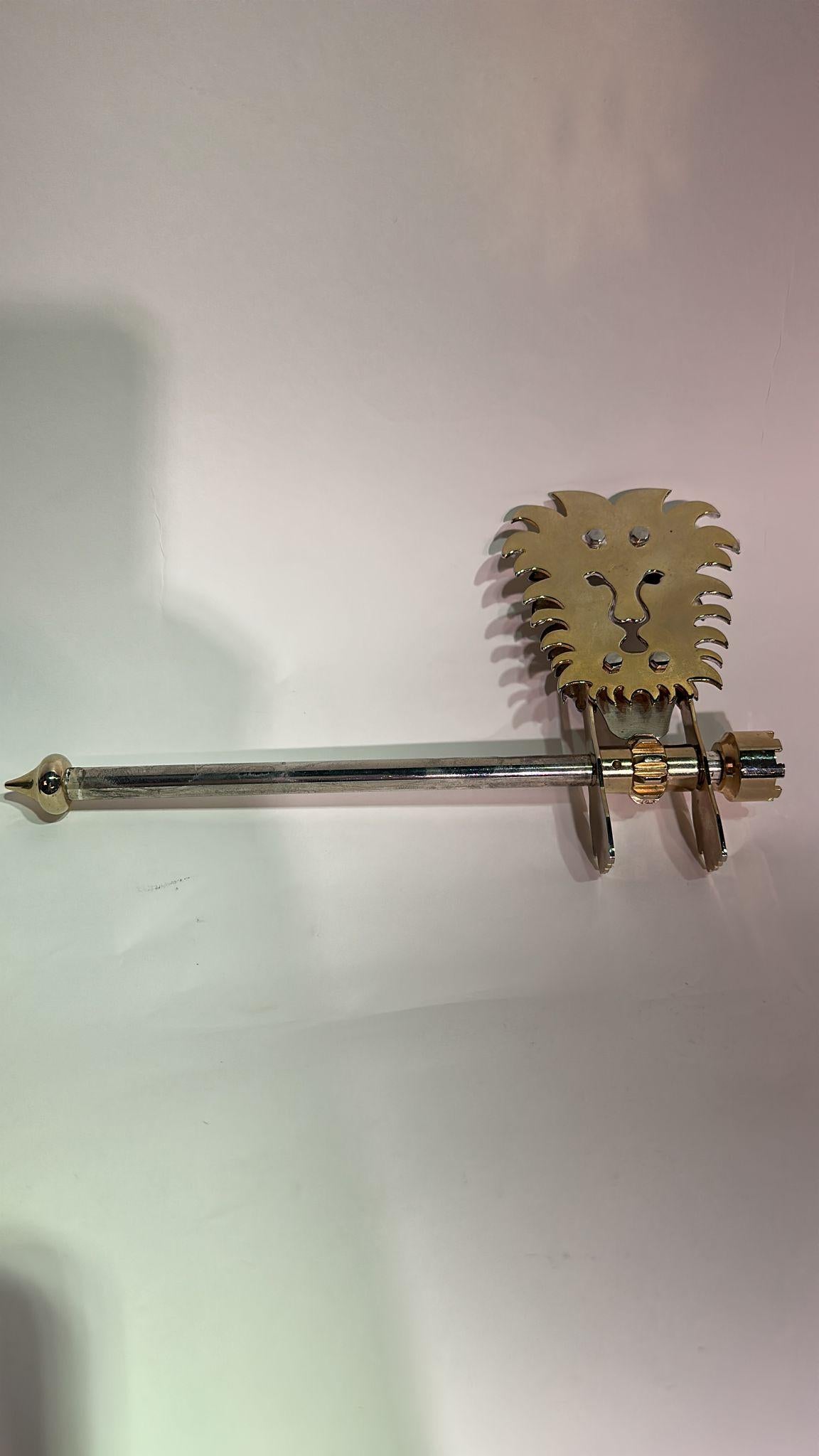 Mid-Century Modern Brass Purim Noisemaker with Lion Motif

This exquisite noisemaker exemplifies mid-century modern design, combining functionality with artistic craftsmanship. The piece is crafted from polished brass, offering a sleek and timeless