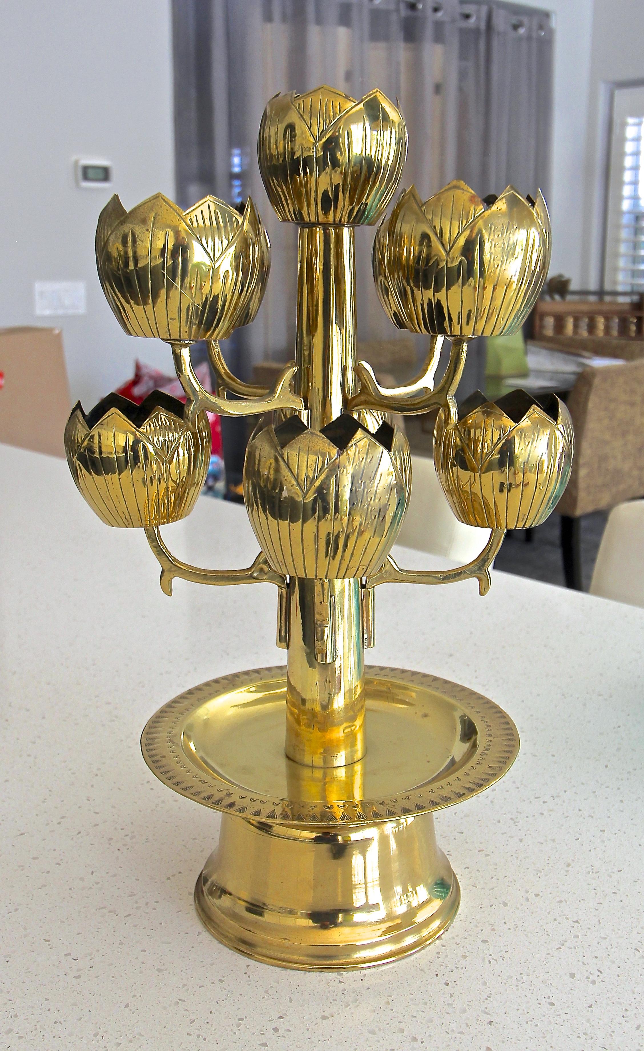 A brass lotus flower 9 cup candleholder or candelabra, attributed to Feldman Lighting Company. Designed to hold votive candles.