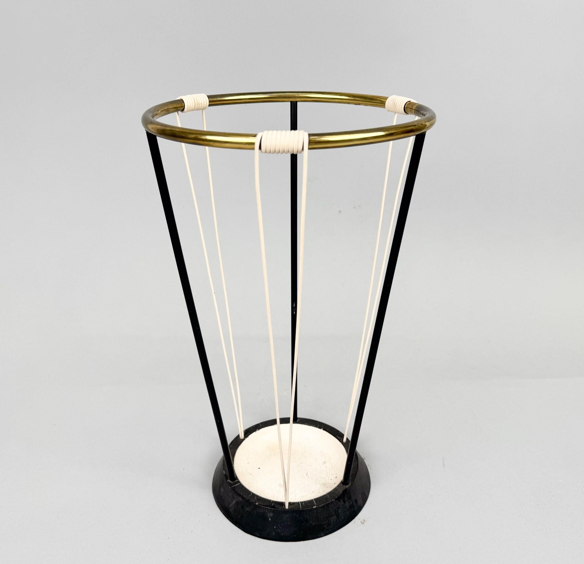 Vintage umbrella stand made of metal, brass and plastic cord. Made in Germany in the 1970's.
