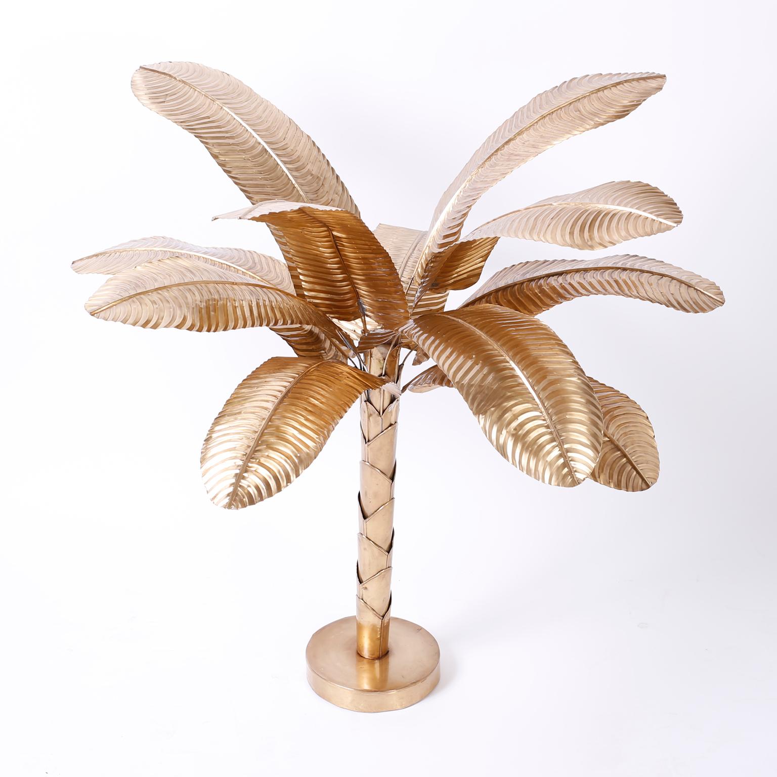 Striking midcentury stylized brass tabletop palm or banana tree with a tropical ambiance suitable for traditional or modern interiors. Hand polished and lacquered for easy care.