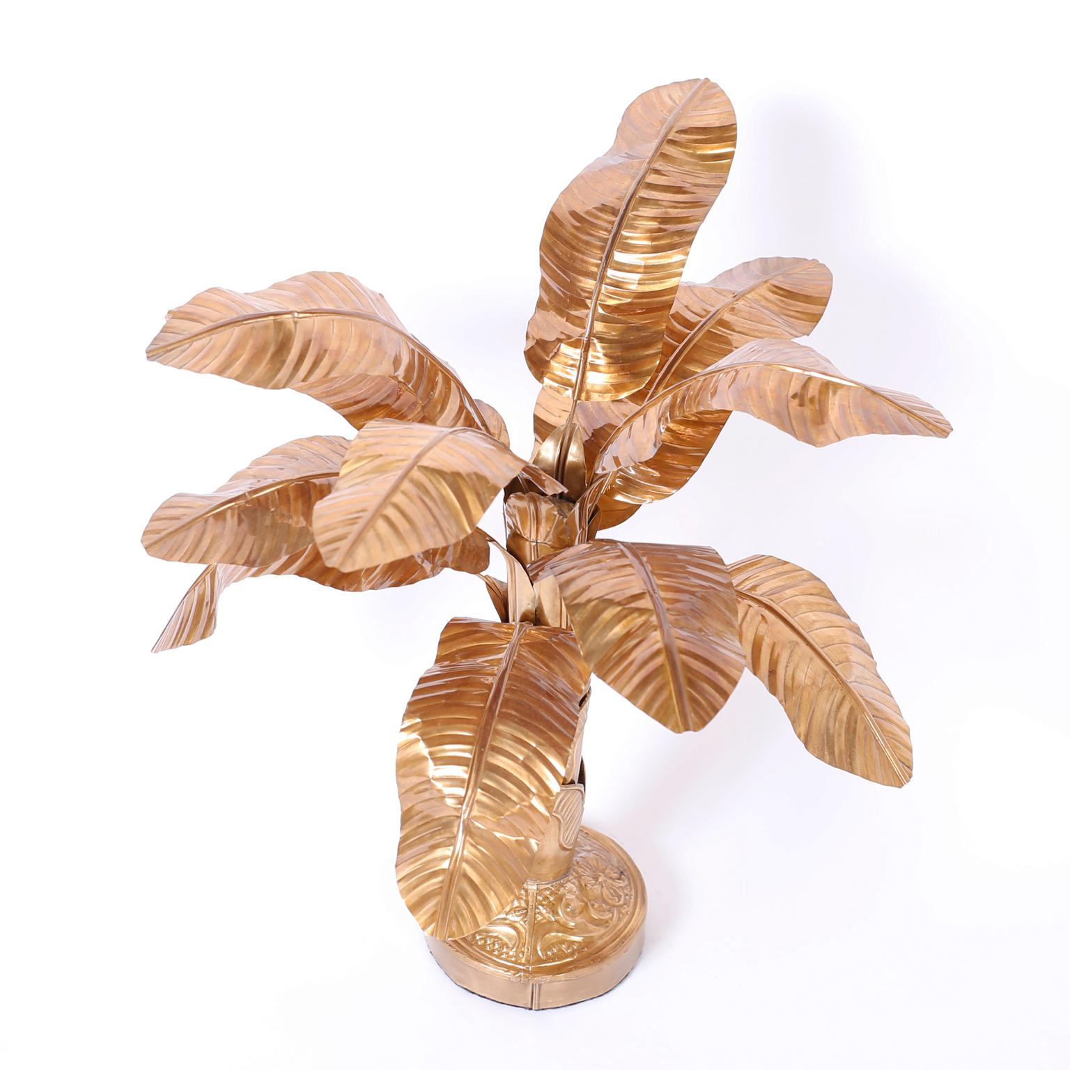 Chic stylized brass palm or banana tree sculpture with a graceful form and a custom finish, hand polished and lacquered for easy care.