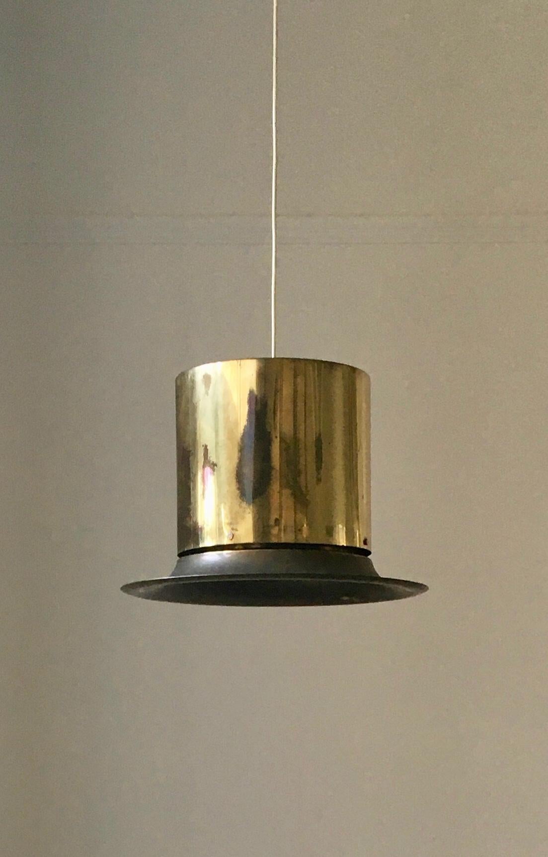 A brass pendant light by Hans-Agne Jakobsson for his company in Markaryd, Sweden, mid-20th century. An unusual and rarely seen piece of Nordic design. Labelled. 

The brass shade and original brass ceiling canopy are in good vintage condition,