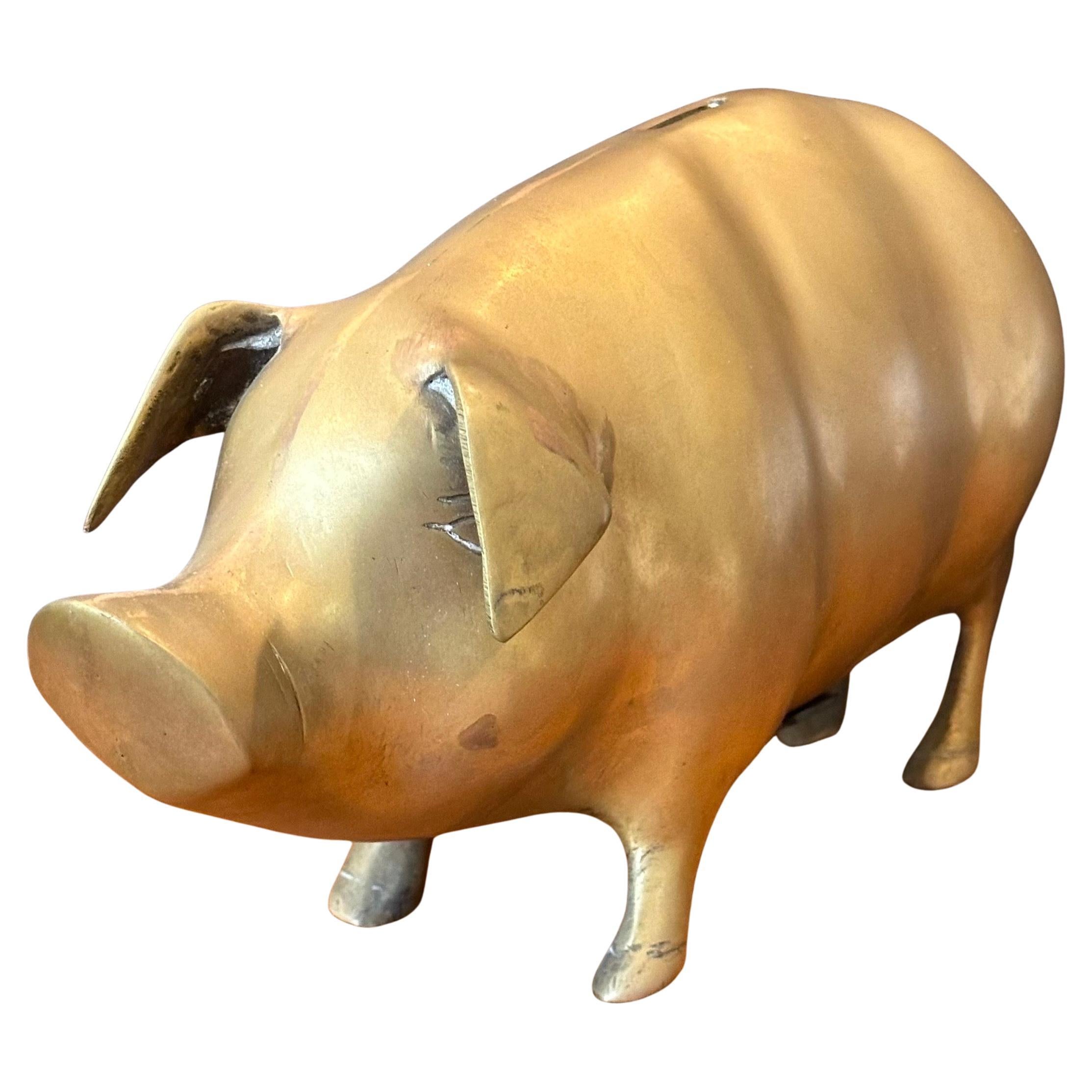 A very cool mid-century brass piggy bank, circa 1970s.  The bank is in good vintage condition and measures 12.5