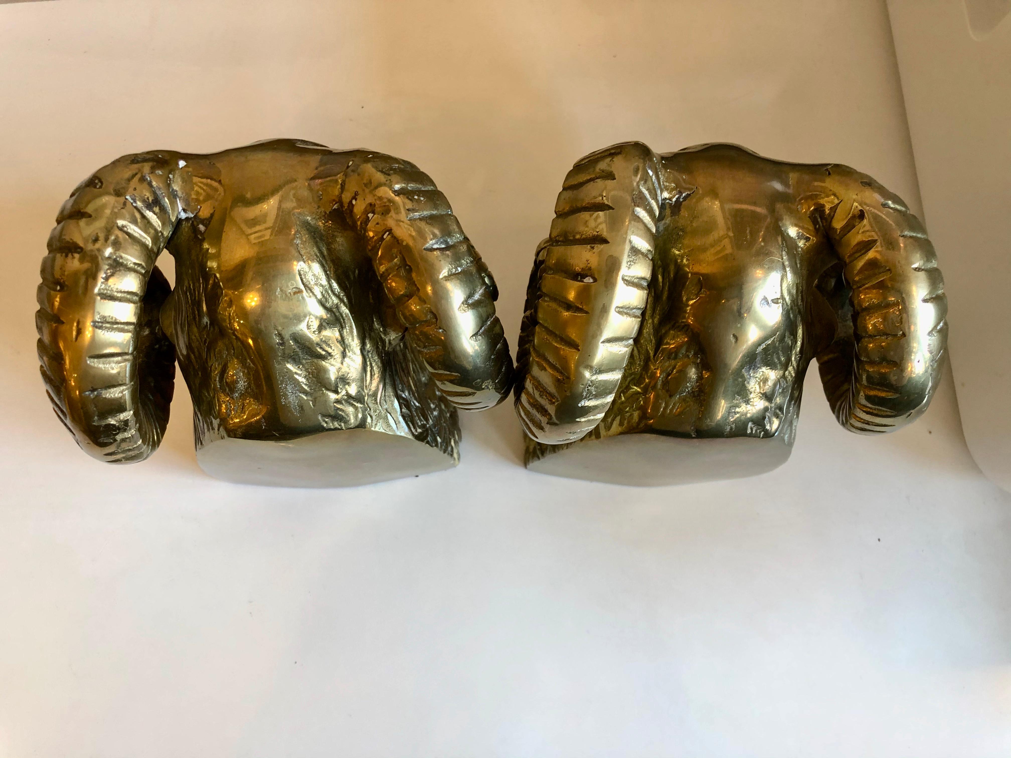 Mid-20th century heavy solid brass rams head bookends.