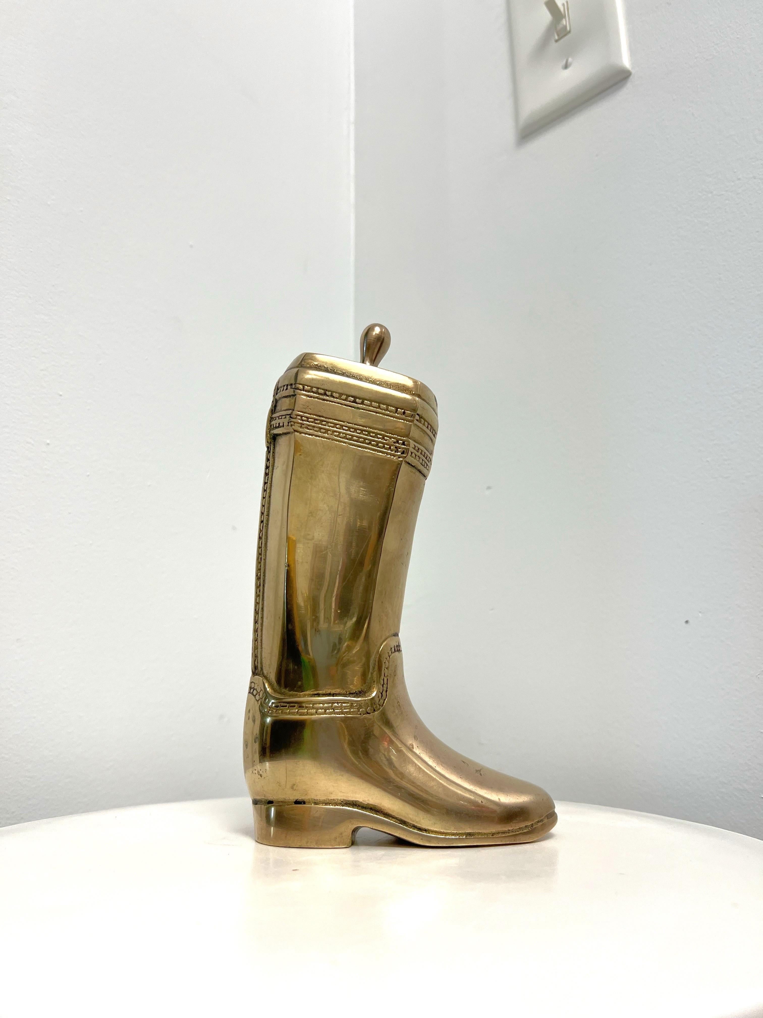 Mid-century solid brass bookends depicting riding boots with buckles and straps.  Polished.