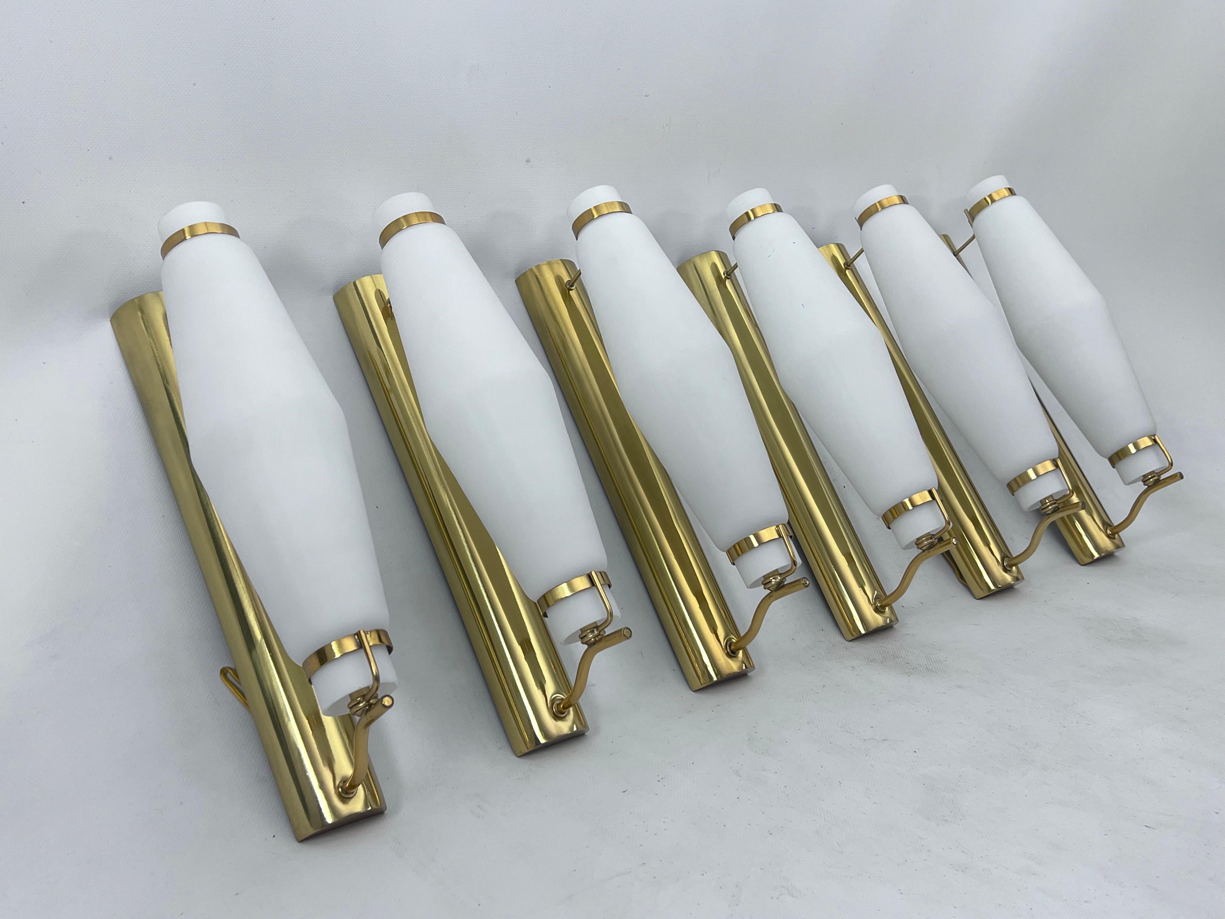 Italian Mid-century brass sconces in the manner of Stilnovo from 50s. Set of six For Sale
