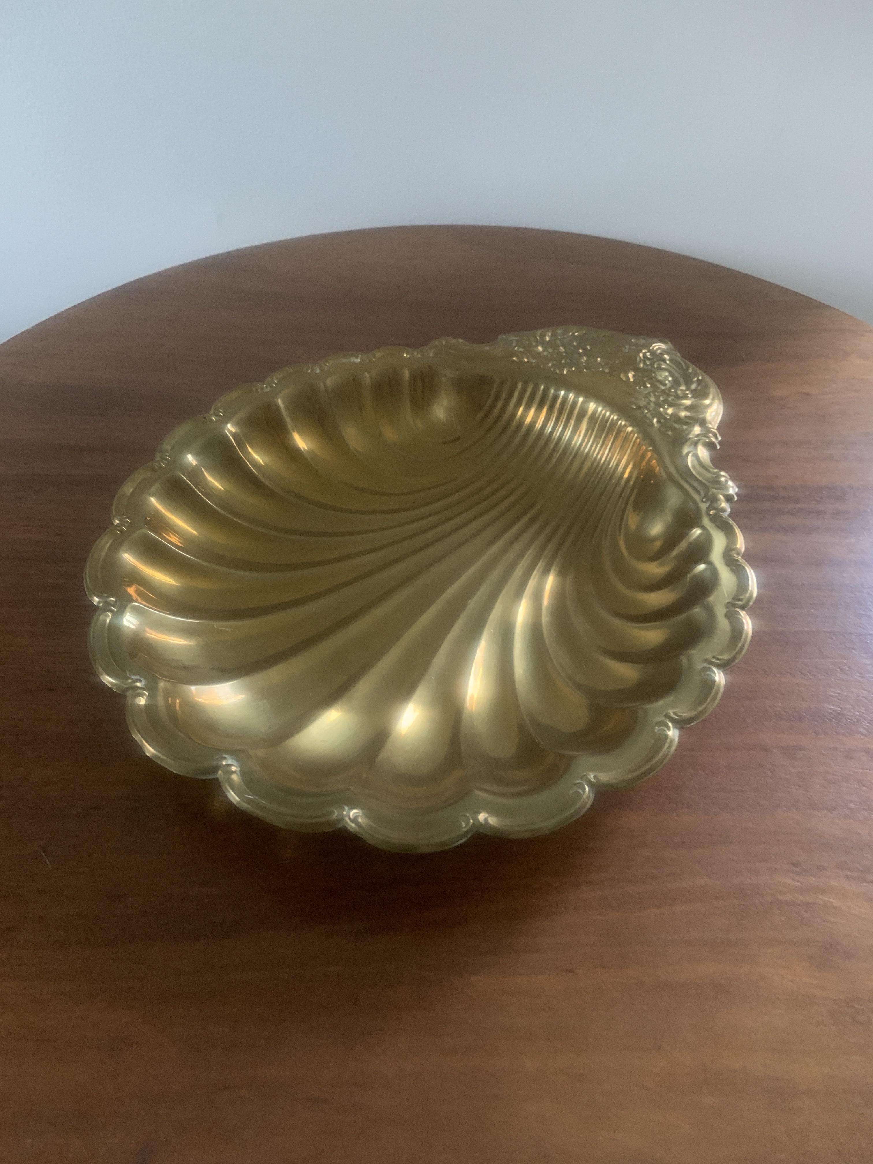 A mid-20th century brass clam shell platter.
 