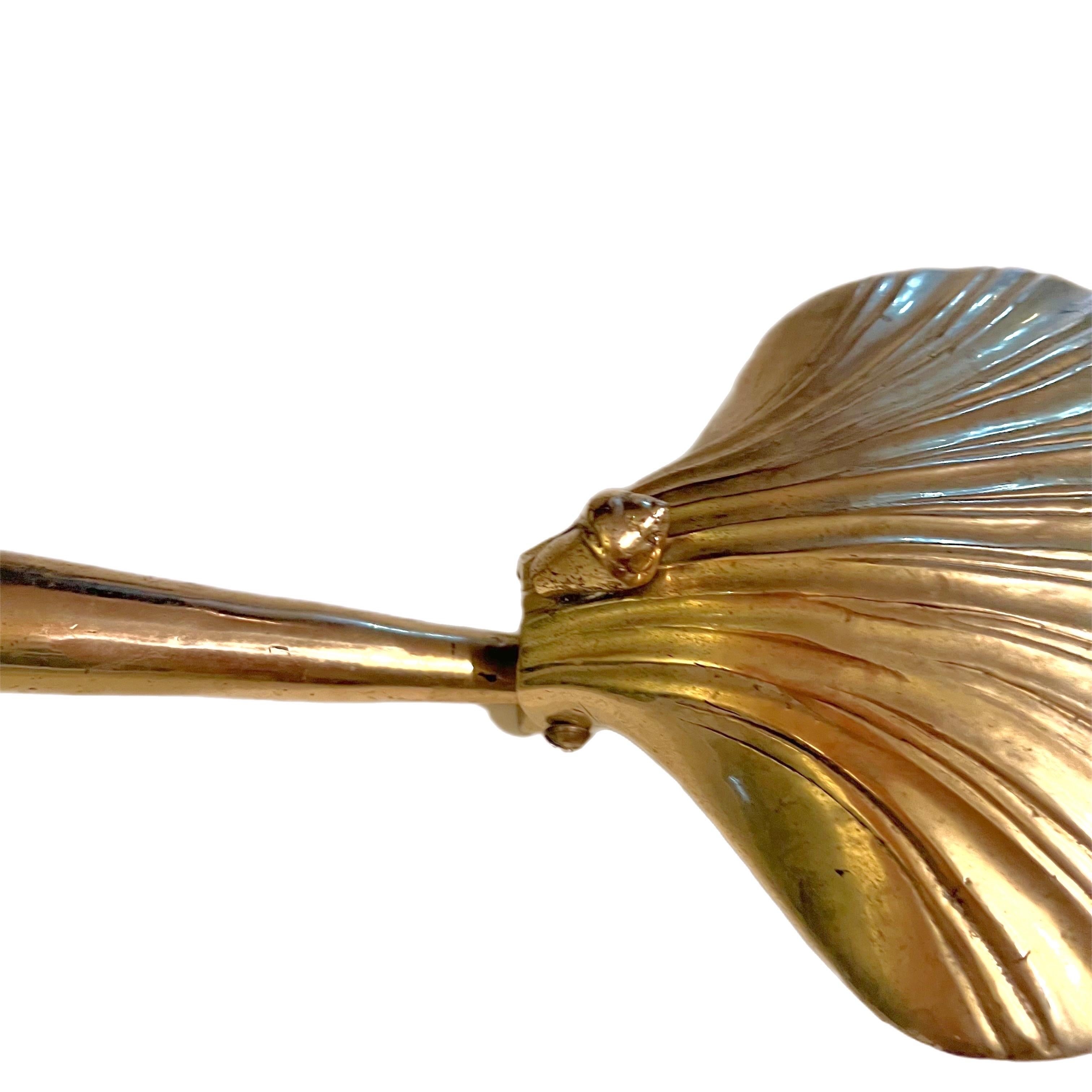 A fantastic mid-Century Coastal shell form silent butler. 
Usually made of copper, brass, or aluminum, a silent butler is 