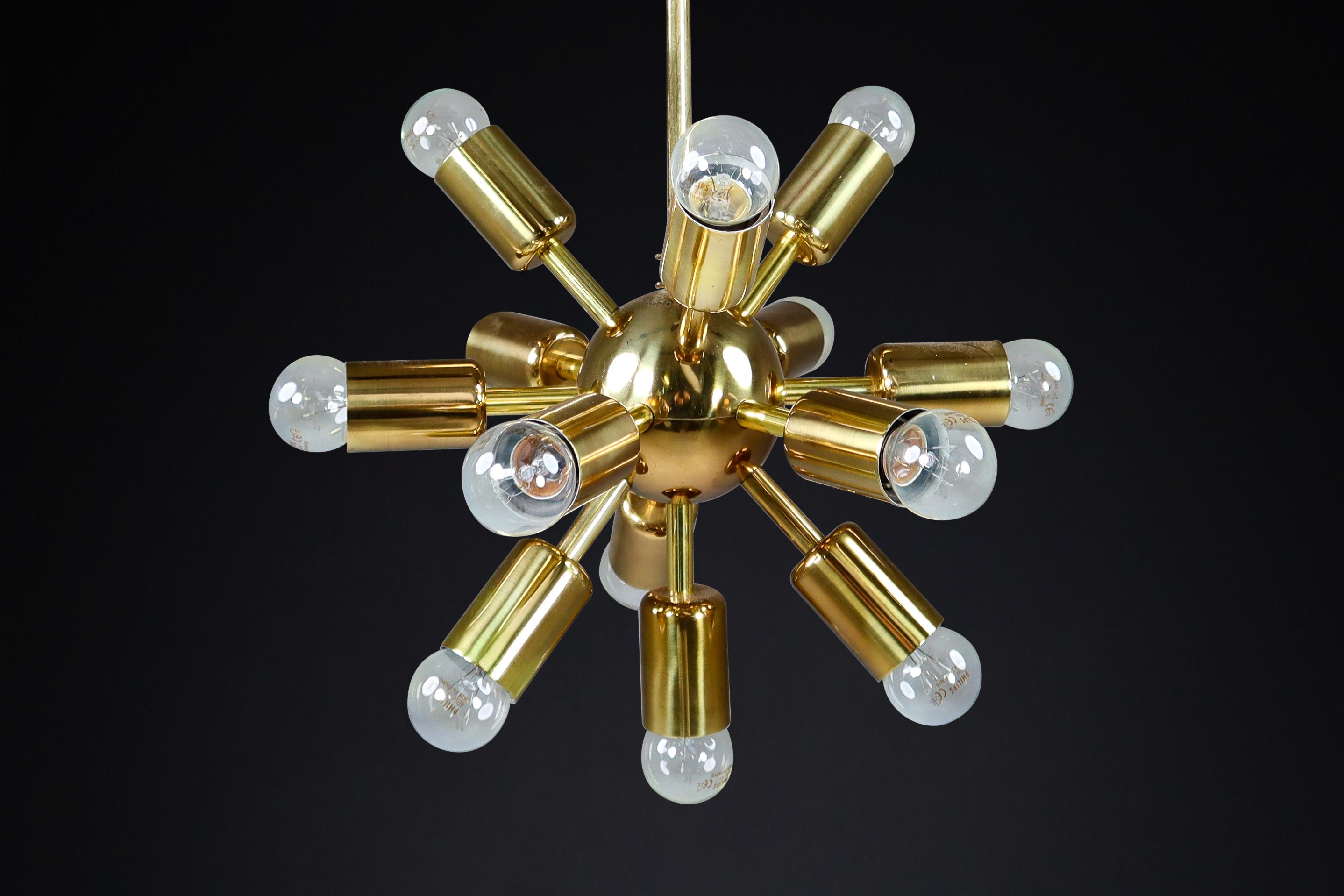 Mid-Century Brass Sputnik Chandeliers by Drupol, Praque 1960s

These brass Sputnik chandeliers with twelve lights are a must-have for any interior looking to add a touch of luxury. They are compatible with various standards, including LED, and