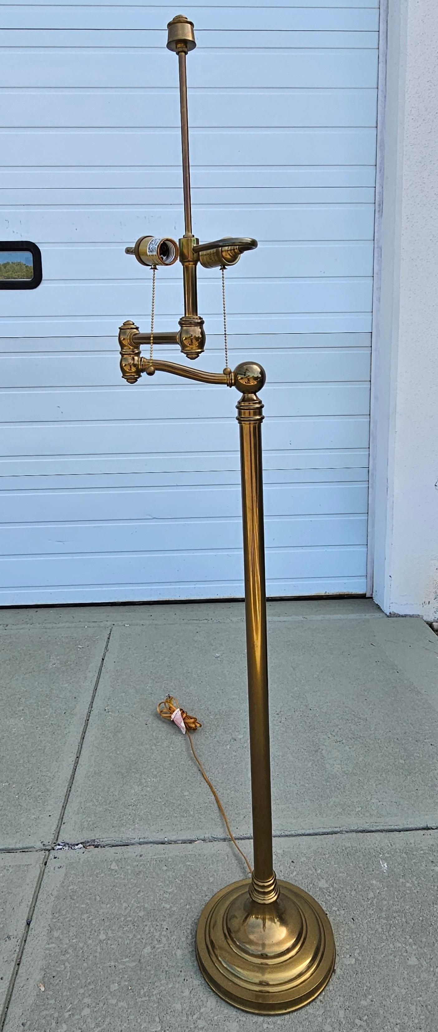A Mid-Century Brass Swing and Extension Arm Floor Lamp
Measures  25.5