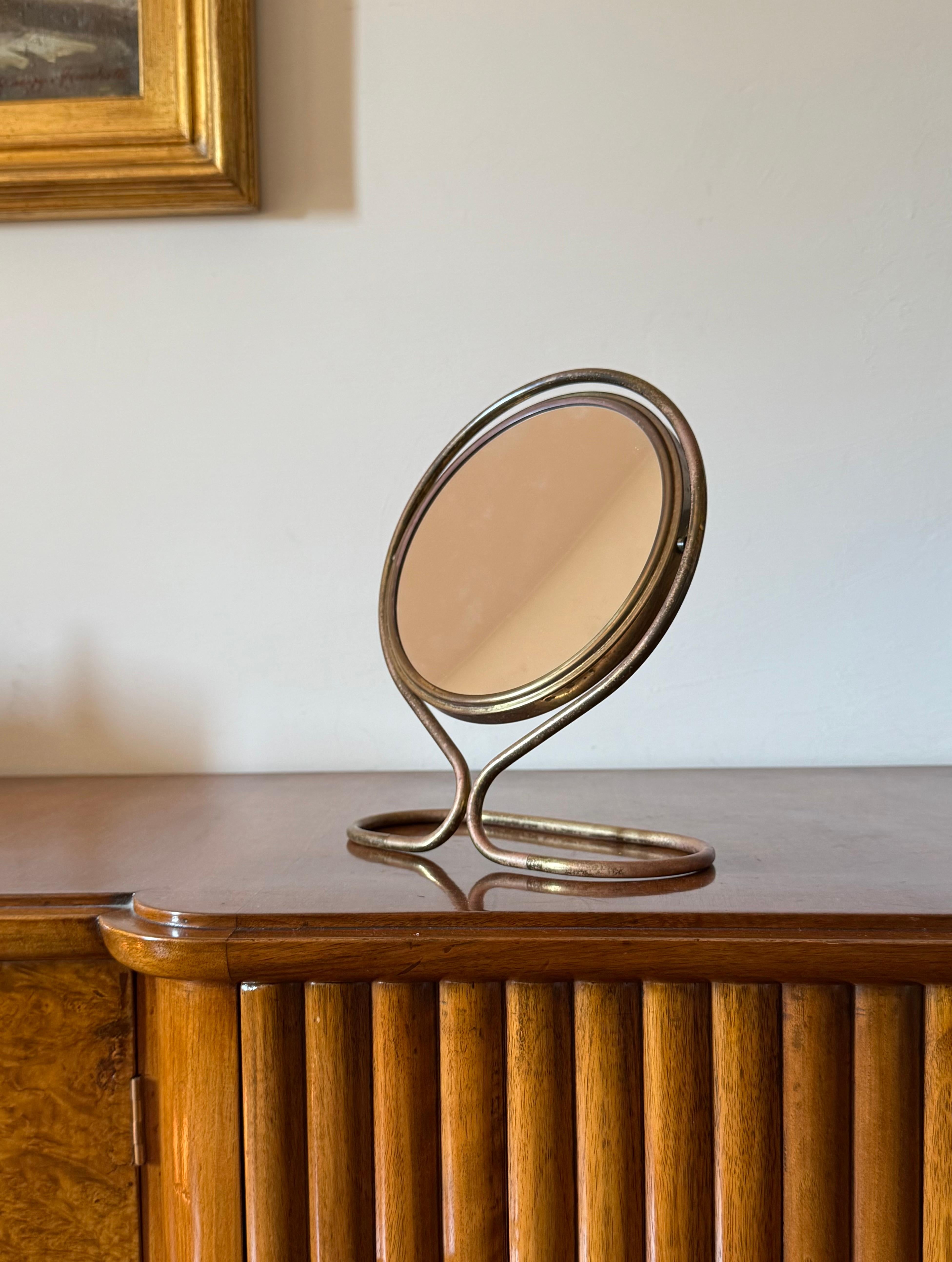 Mid-century brass table mirror / vanity 

France 1950s

brass, mirror

Double mirror, one of them magnifying

H 26 cm x 22 × 13 cm

Conditions: excellent consistent with age and use.