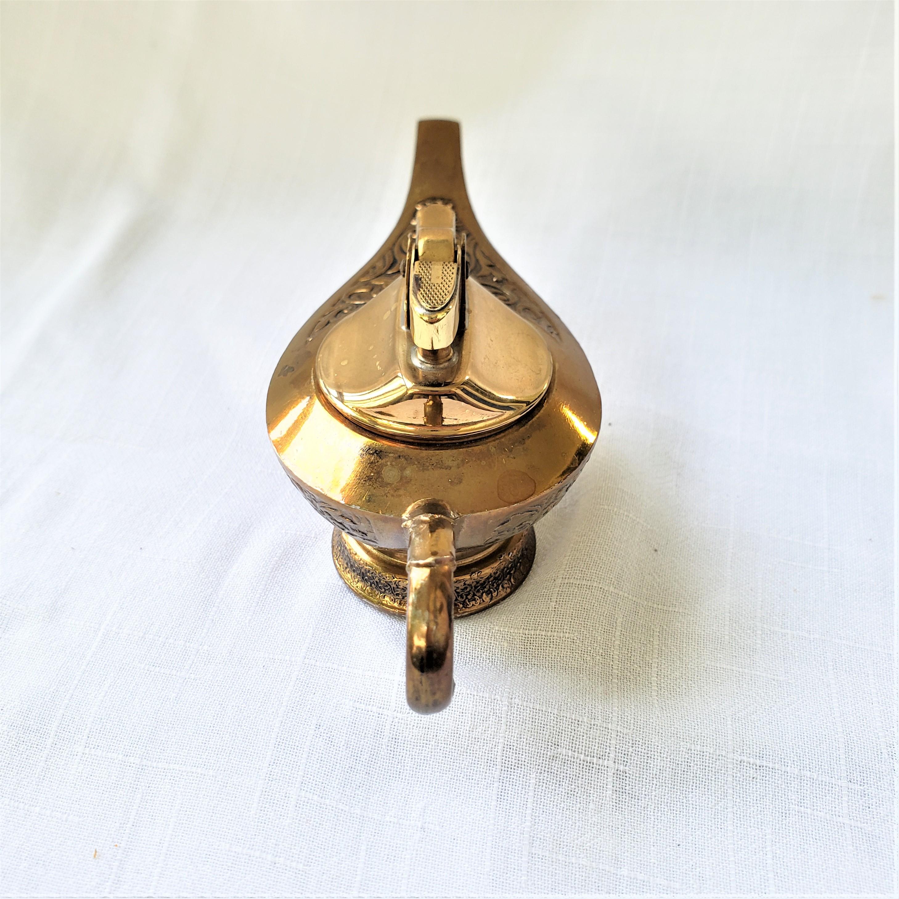 Cast Mid-Century Brass Toned Figural Aladdin's Oil Lamp Styled Table Lighter For Sale