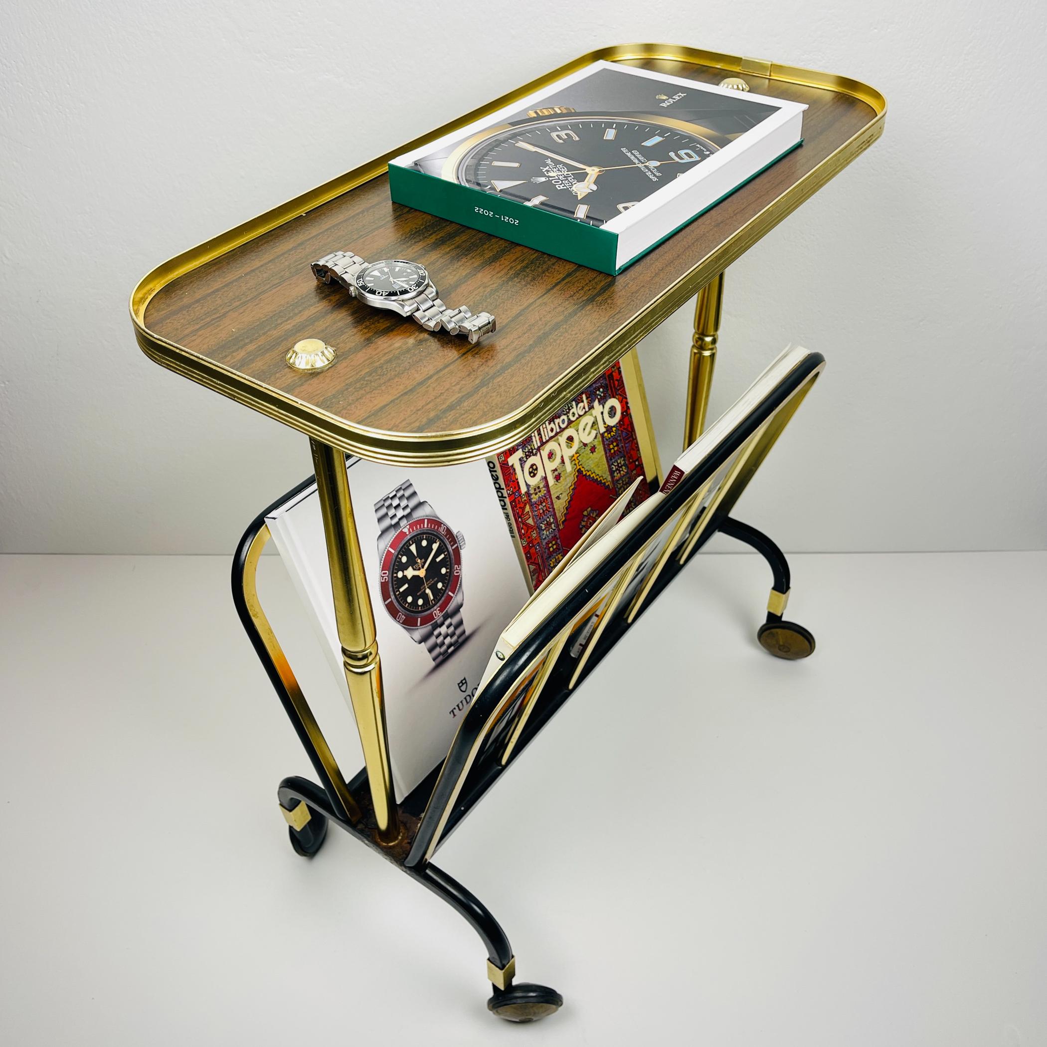 Vintage gold trolley by MB made in Italy in the 1960s. Made of Formica - combined aluminum and gold metal. It can be used as a side table, a newspaper holder, or a trolley in the living room.

Dimensions:
Width: 56 cm / 22.1 inches
Height: 60 cm /