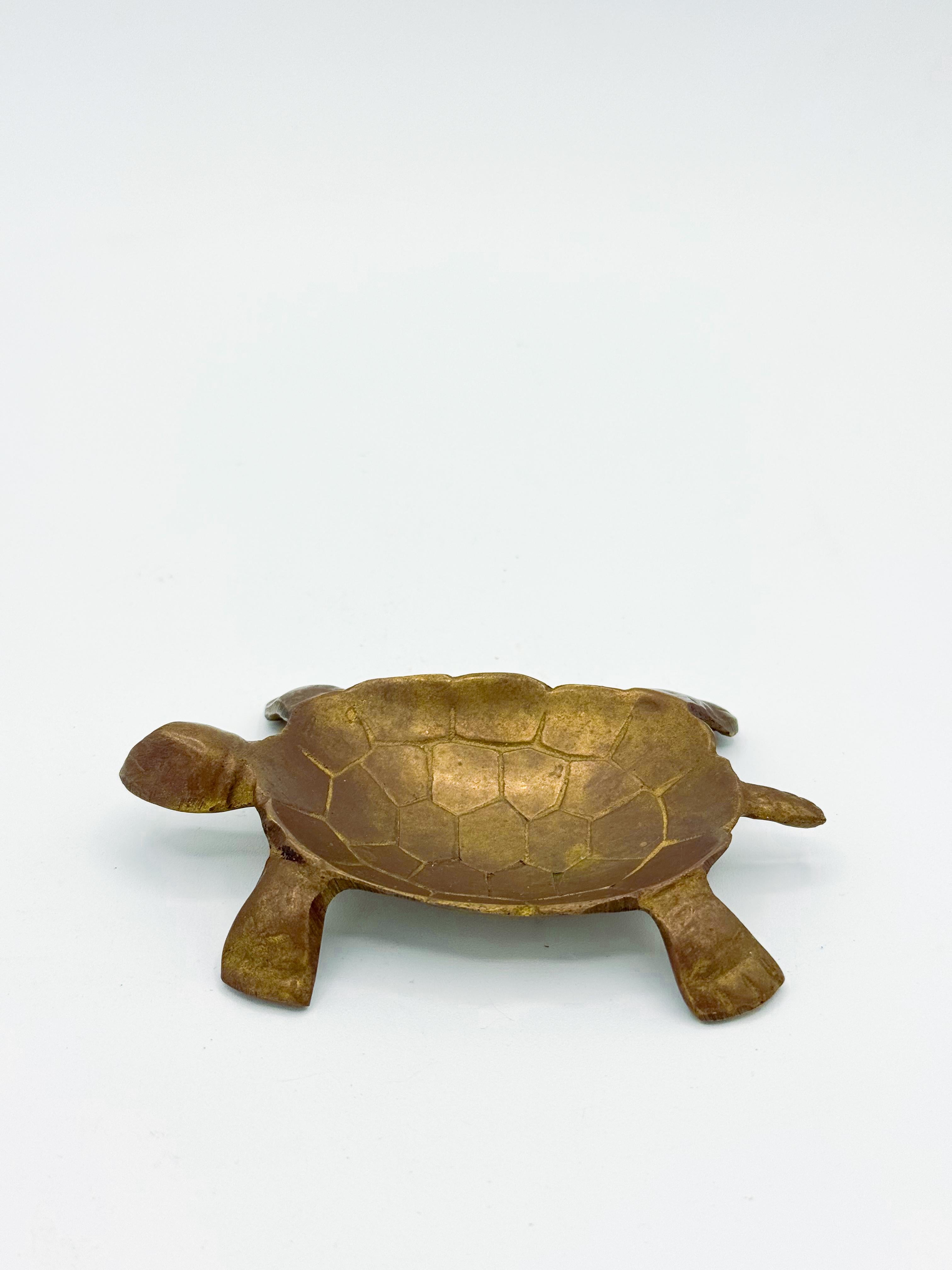 Add a touch of charm to your space with this Mid-Century Brass Turtle Catchall Dish, a beautifully crafted vintage piece perfect for both functional and decorative use. Featuring a detailed turtle design in solid brass, this unique dish serves as an