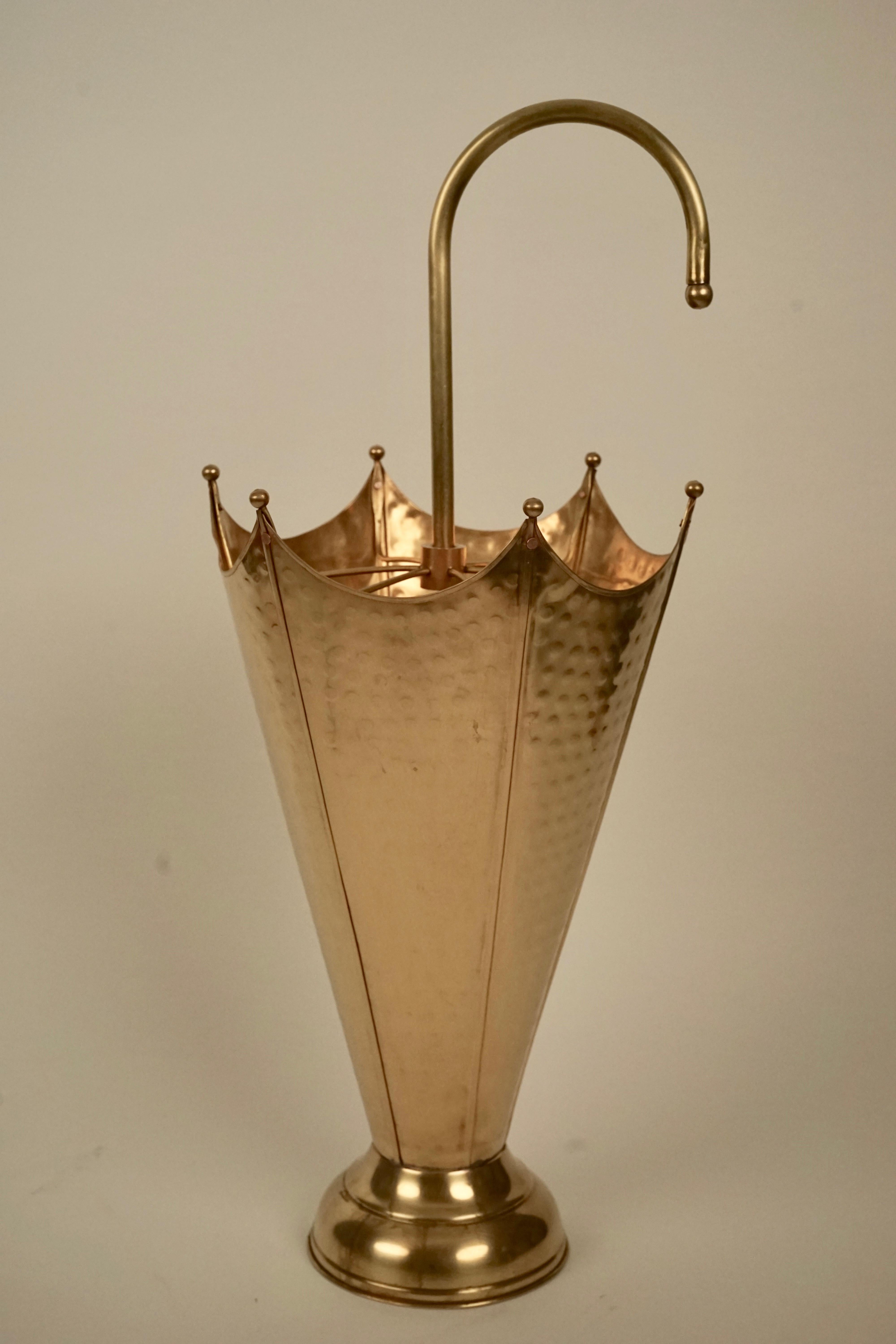 Another umbrella stand from the 1960's . This wonderful decorative object, formed out of hammered brass
into an umbrella form. 

This is a wonderful decorative object for every entrance way.