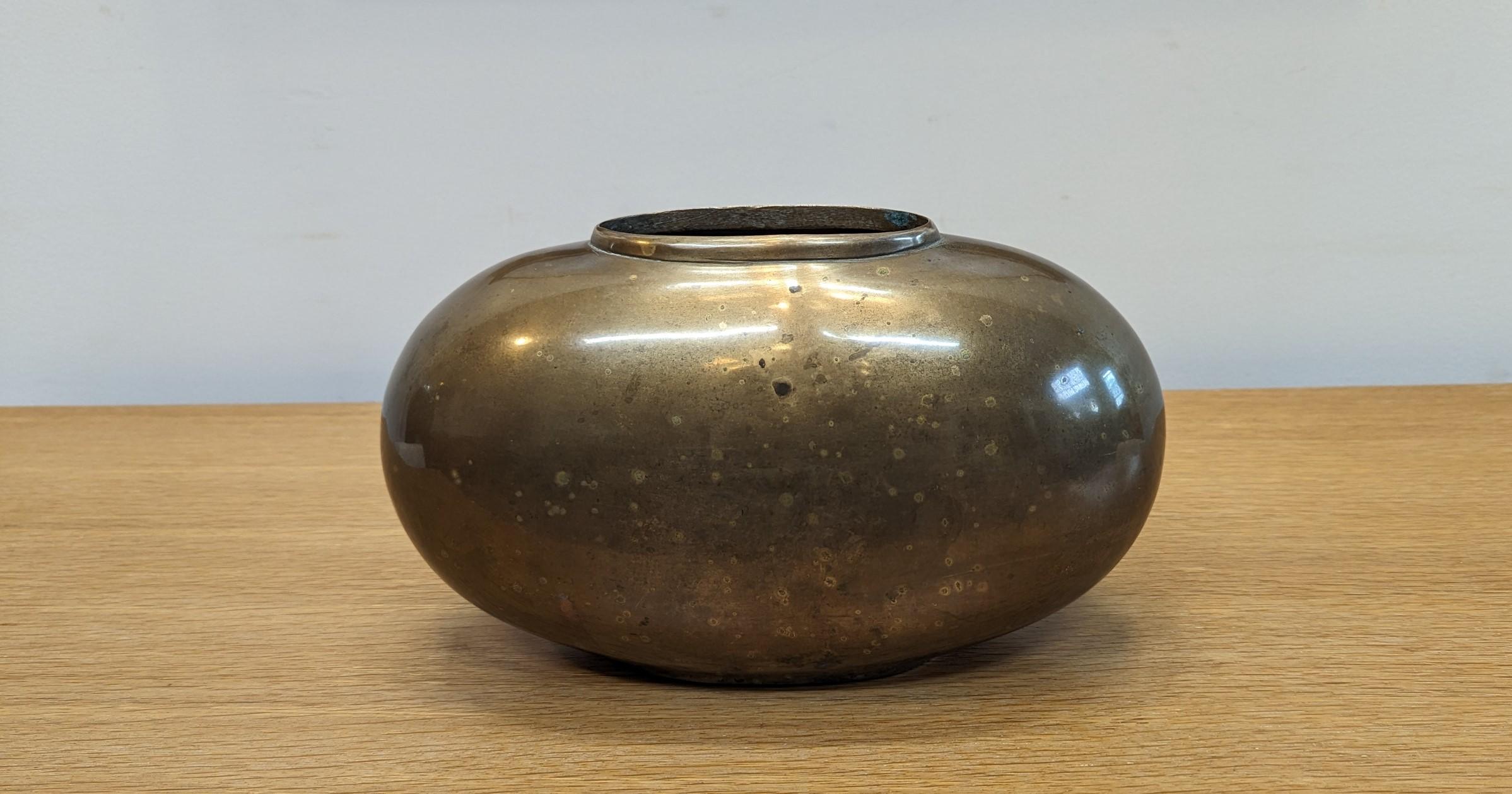 A beautiful Brass Oval Vase.  Subtle sublime design having a sculpted oval. Solid Brass with very nice speckled patina, one side has more speckling then the other.   In very good original condition.  Can be used to hold water with flowers or