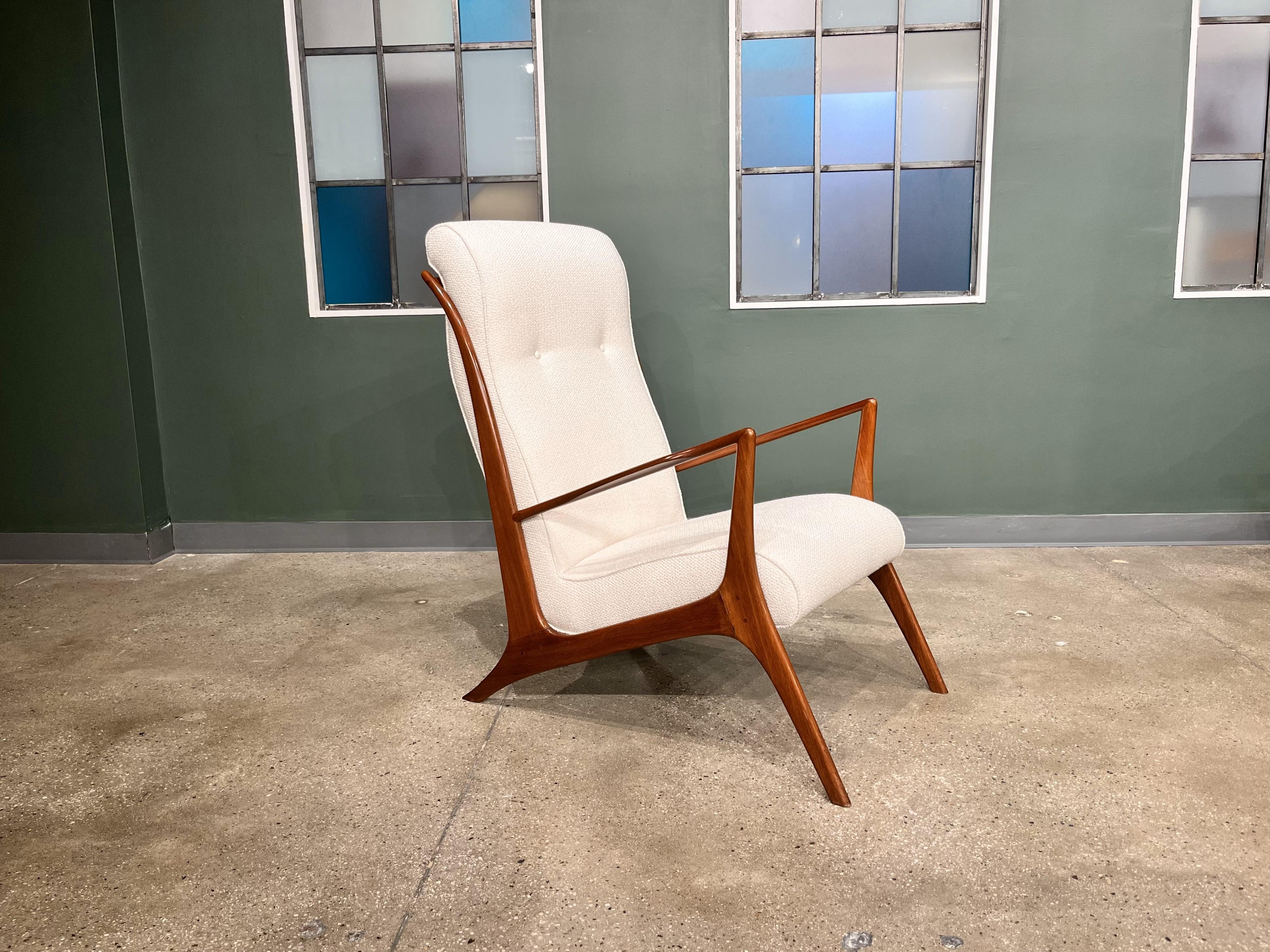 Discover the exquisite mid-century Brazilian modern armchair crafted by John Graz in the 1950s, available today! This stunning chair showcases a caviuna hardwood frame and a comfortable Beige Bouclé  seat. Boasting a low seat and an ergonomically
