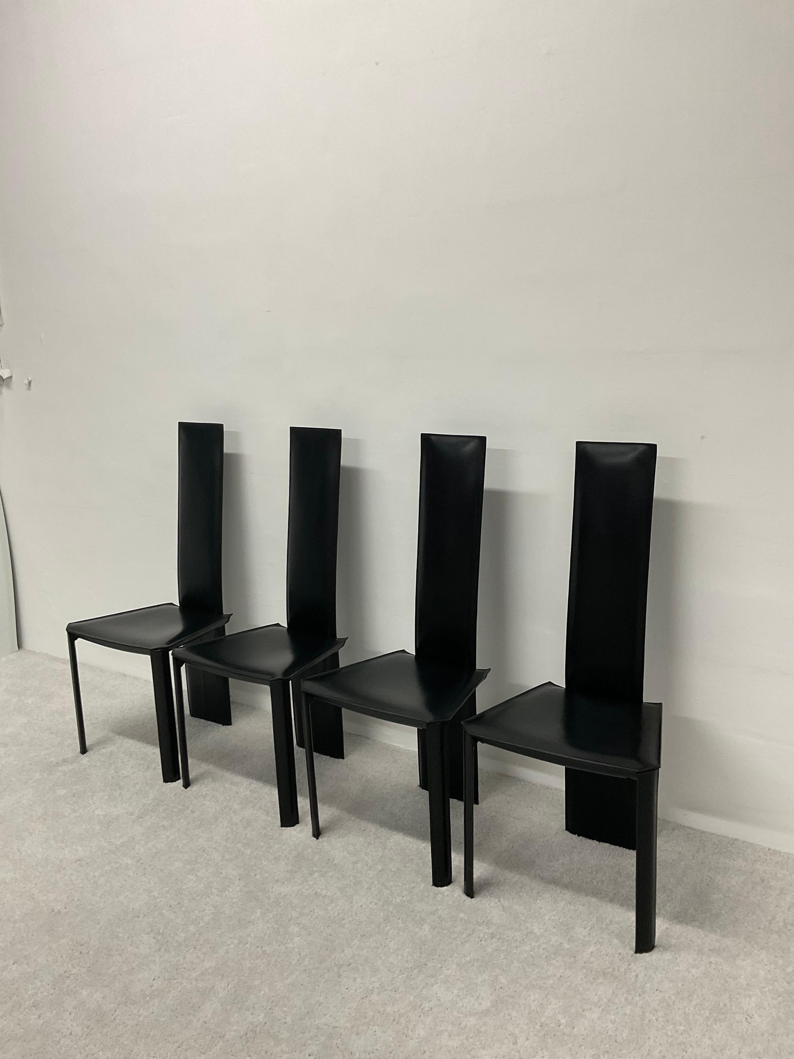 Set of four Brazilian Postmodern black hand stitched leather dining chairs by De Couro, 1980s. These rare chairs share similar qualities to the Mario Bellini CAB chairs for Cassina.