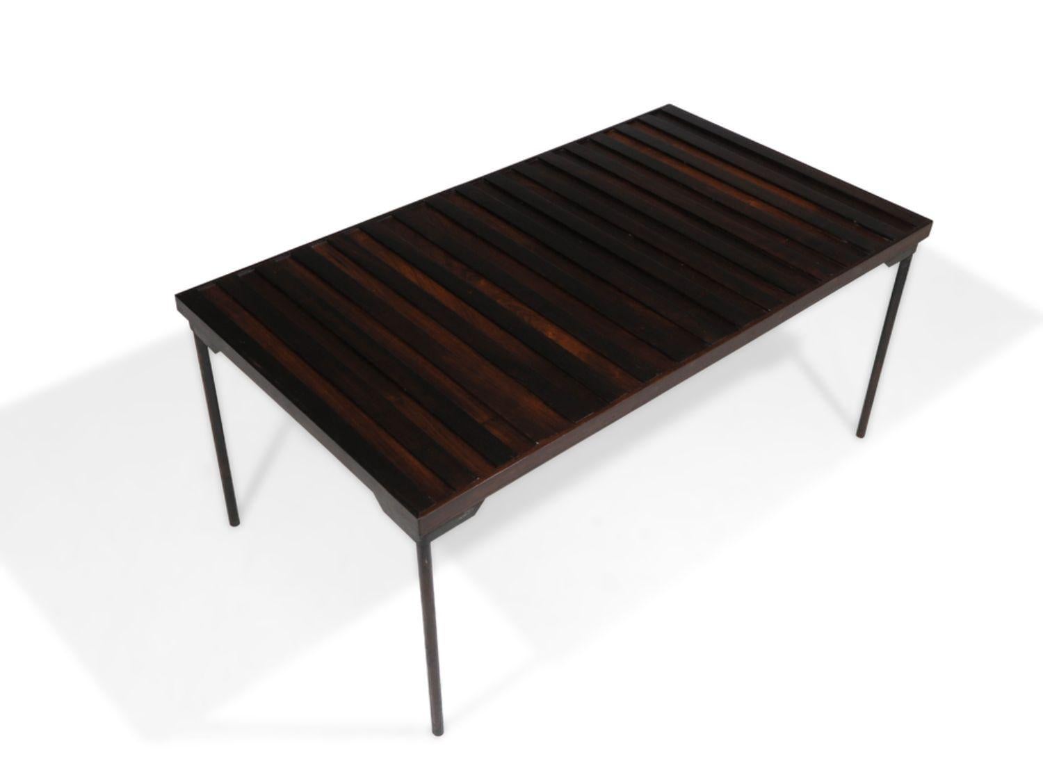 1960's Brazil Modern rosewood coffee table crafted of rosewood slats assembled to a wrought iron frame. The coffee table is in good condition with minor signs of age and use.
Measurements 
W 38.75'' x D 21.75'' x H 17.25''