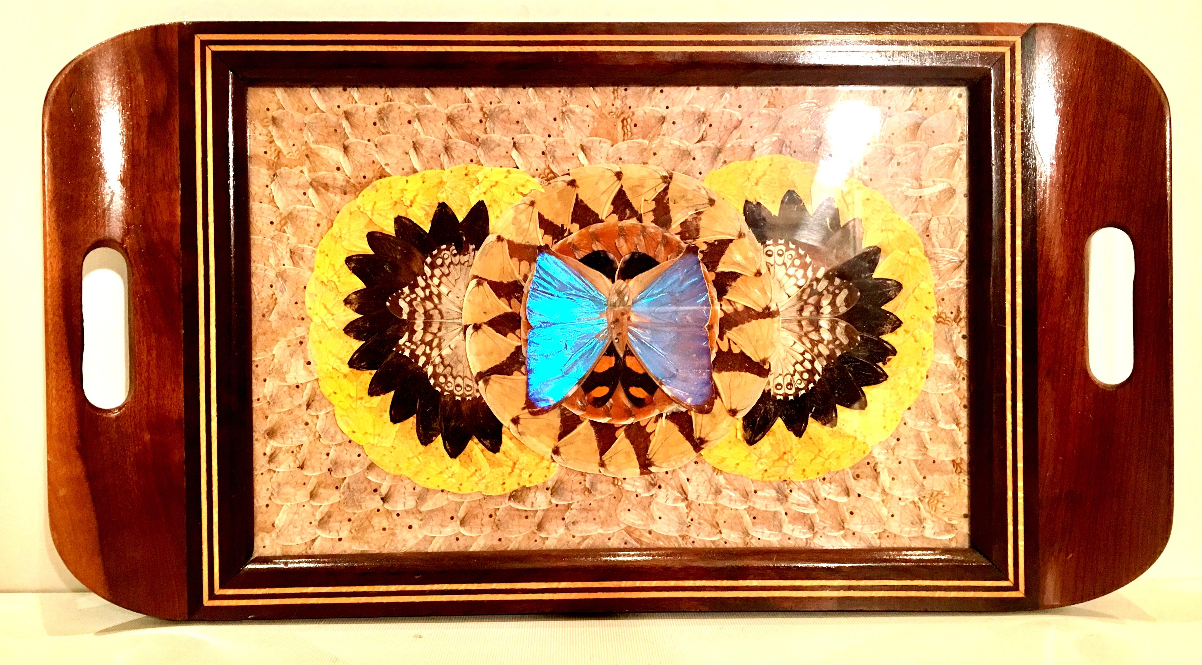 Mid 20th-Century Brazilian wood, brass inlay pressed neon blue butterfly under glass Brazilian wood cut-out handle tray. Tray features brass inlay detail and is in excellent vintage condition.