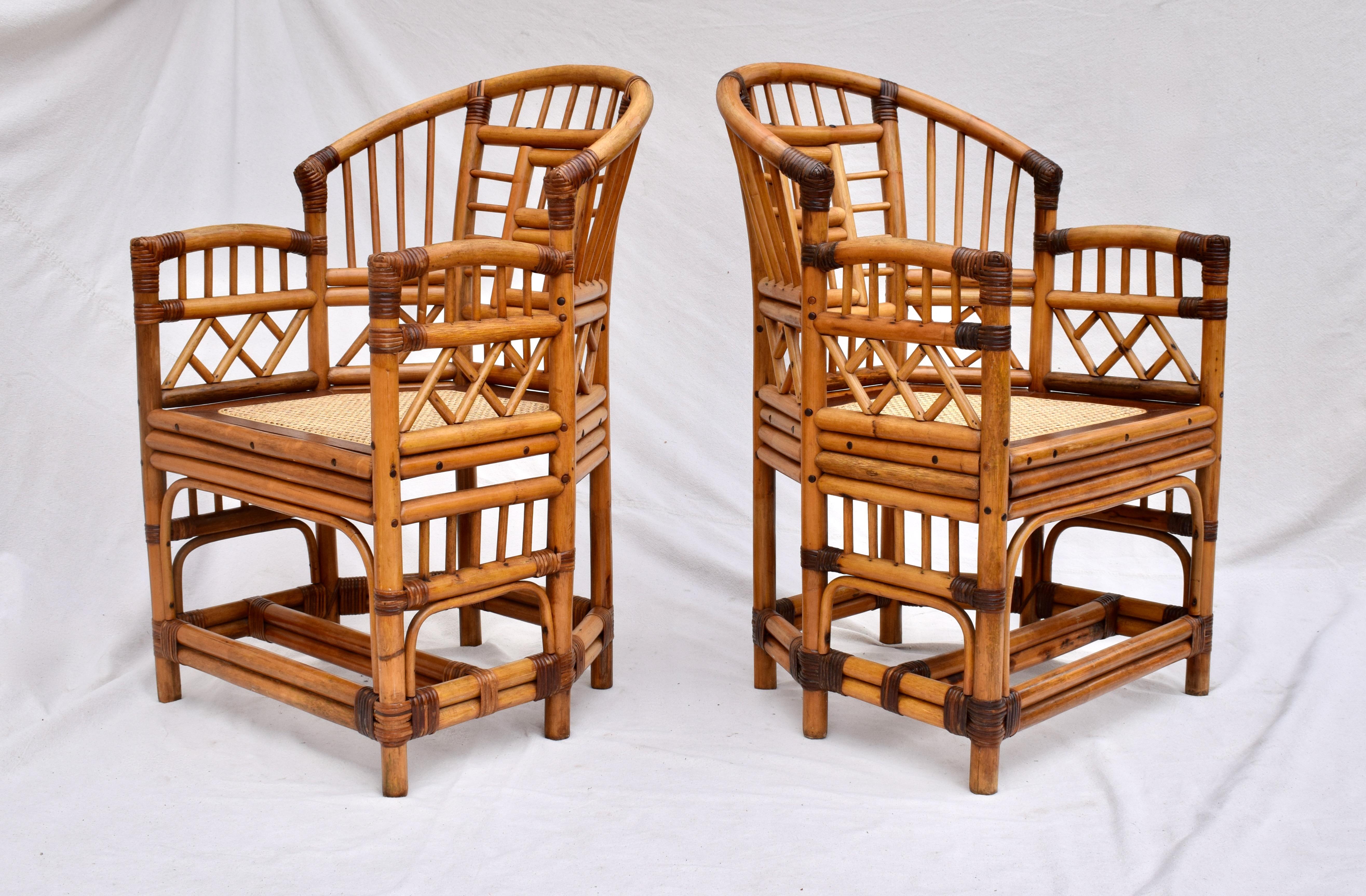 Pair of 1950s Brighton Pavilion chairs fully restored with heavy bamboo frames, new caned seats & solid Mahogany seat frames. .These older versions boast r.ock solid heirloom quality & construction with substantial weight. Seats: 17