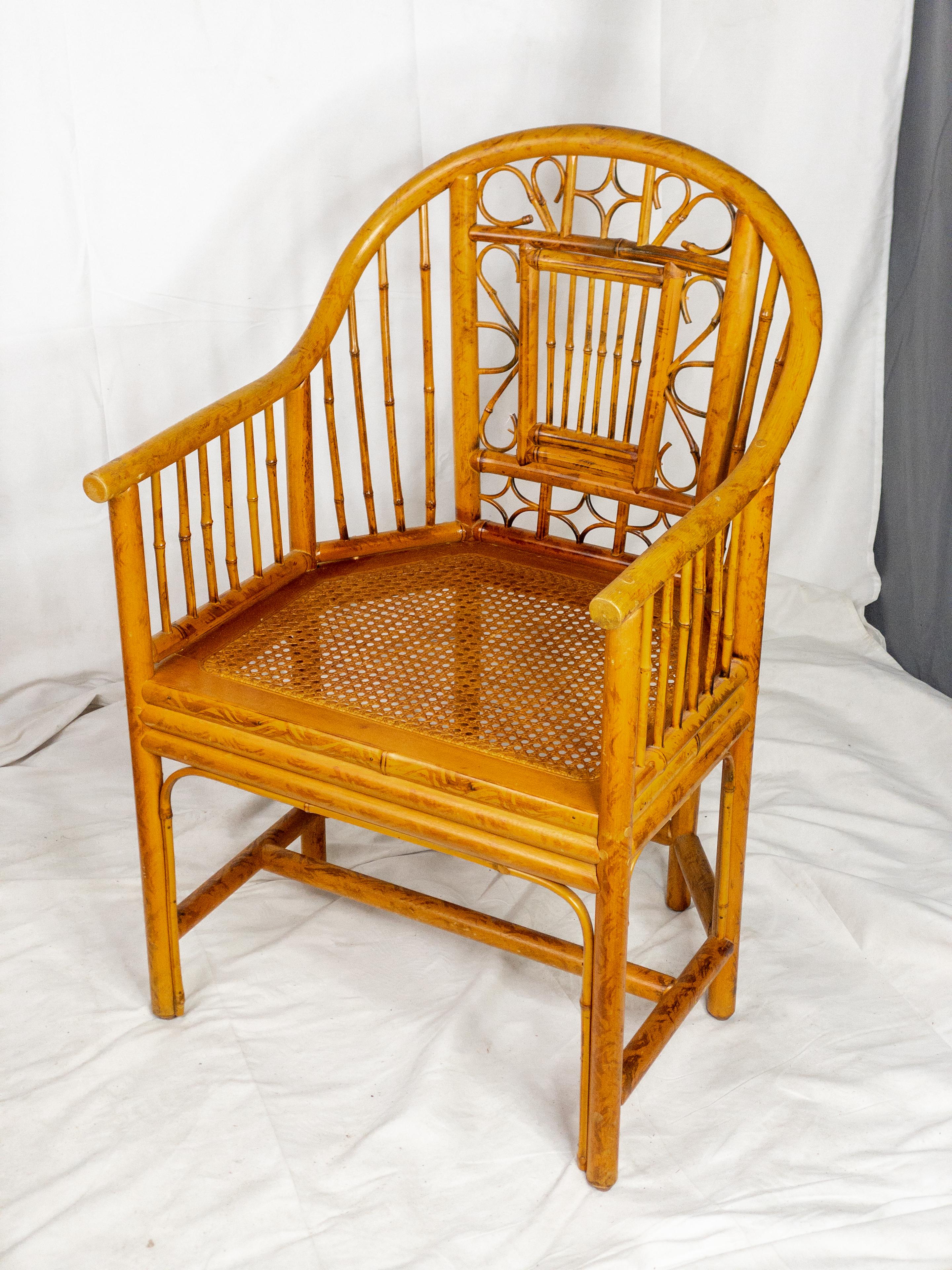 Indulge in the captivating allure of the Mid Century Brighton Pavilion Style Caned Seat Bamboo Chair, an exquisite masterpiece that transcends time and design boundaries. The chair's bamboo frame, a testament to mid-century ingenuity, effortlessly