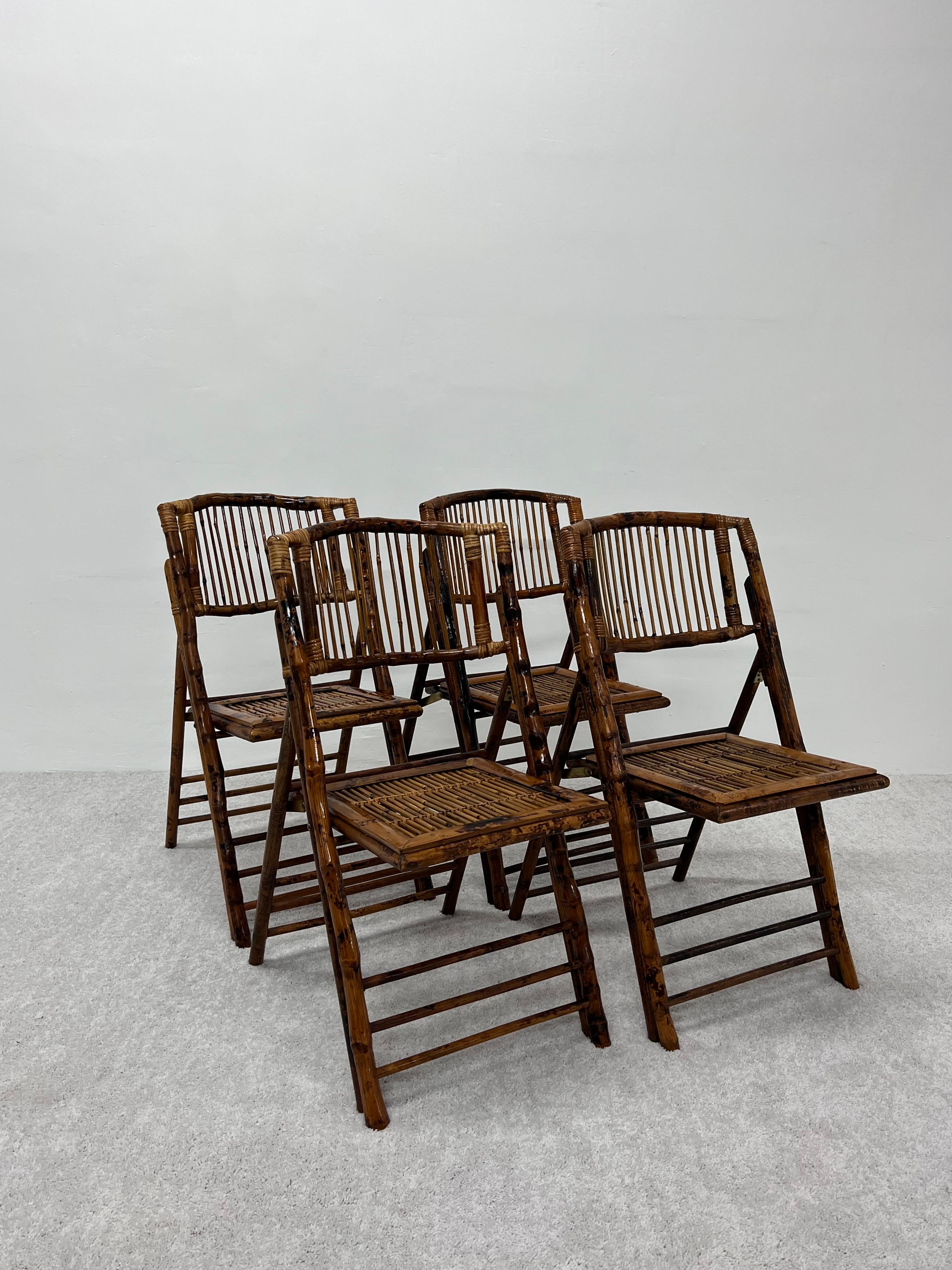 Set of four bamboo folding chairs in the British Colonial Campaign style.