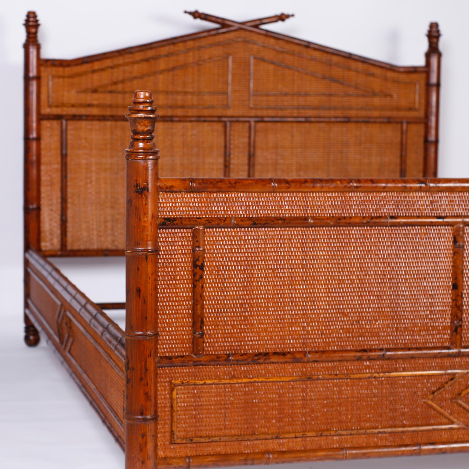 Midcentury British colonial queen size bed frame with faux bamboo posts, turned finials and applied details over a grasscloth background.