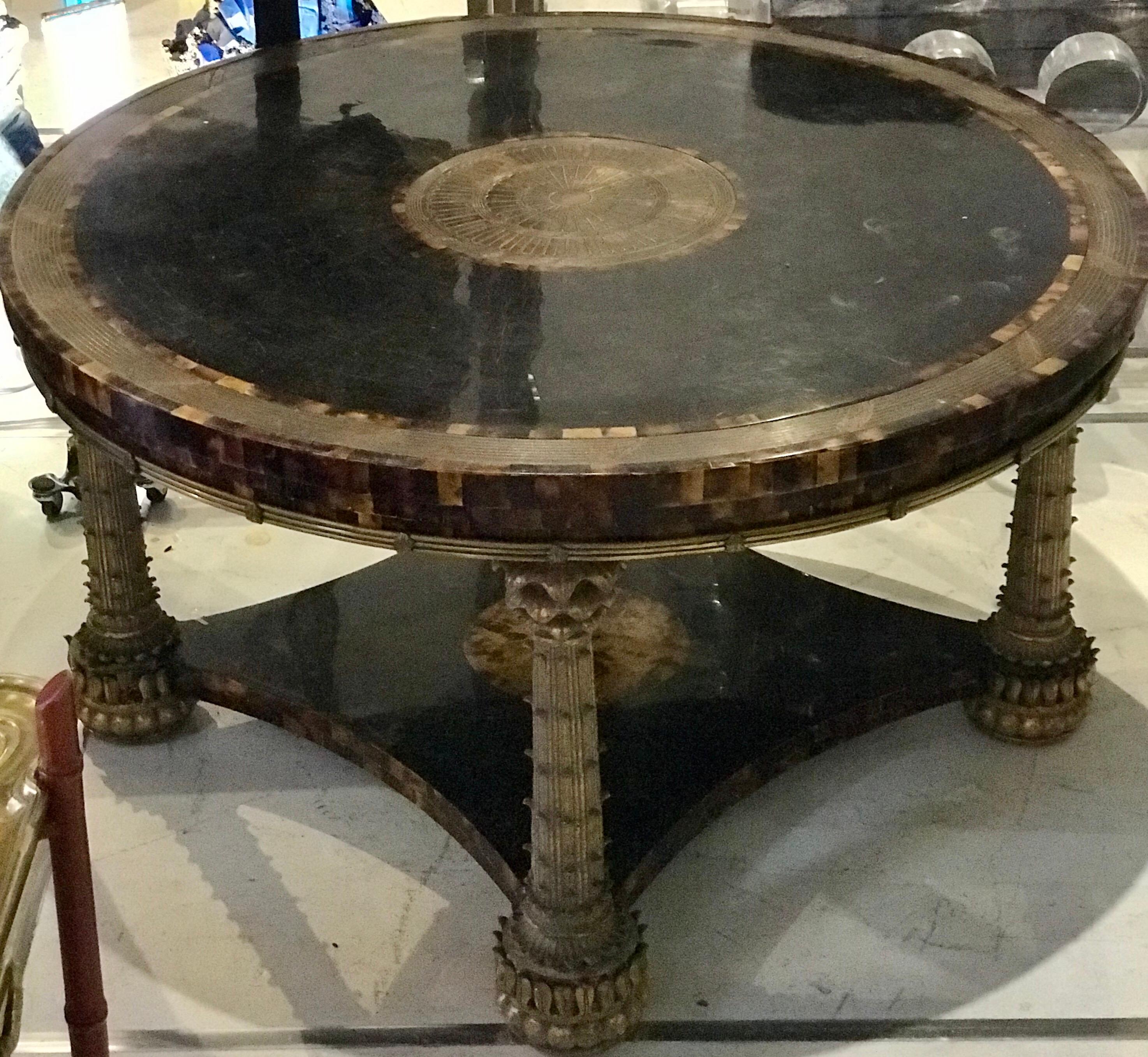 A gorgeous rare tessellated horn coffee table with beautiful bronze Palm Tree legs and center piece, by Maitland Smith.