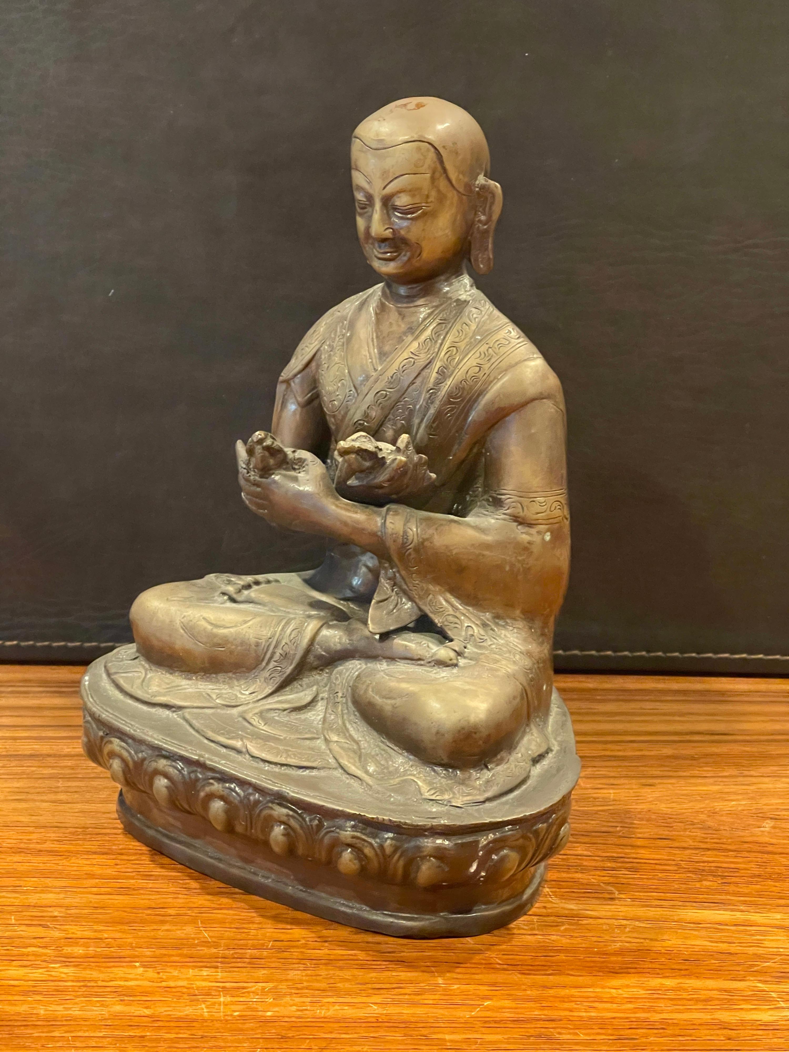 Decorative mid-century bronze Buddha circa 1960s. The piece is in very good vintage condition and measures: 7
