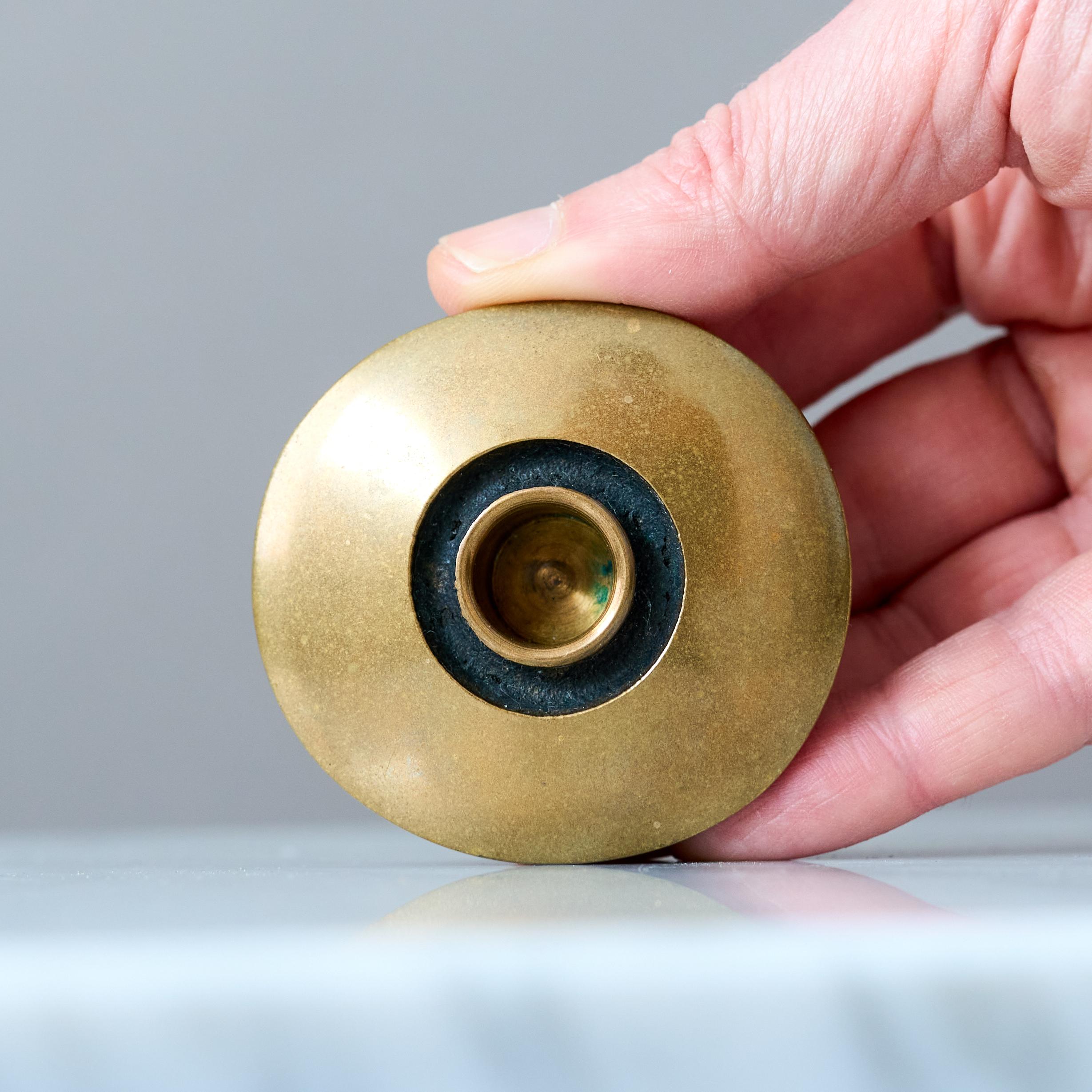 A small and beautiful Scandinavian Modern bronze candle holder with amazing patina. 
Designed by silversmith Bertel Gardberg and made in solid bronze by BODA, Finland 1950s.  

Great original condition, only some light scratches. Can be polished if