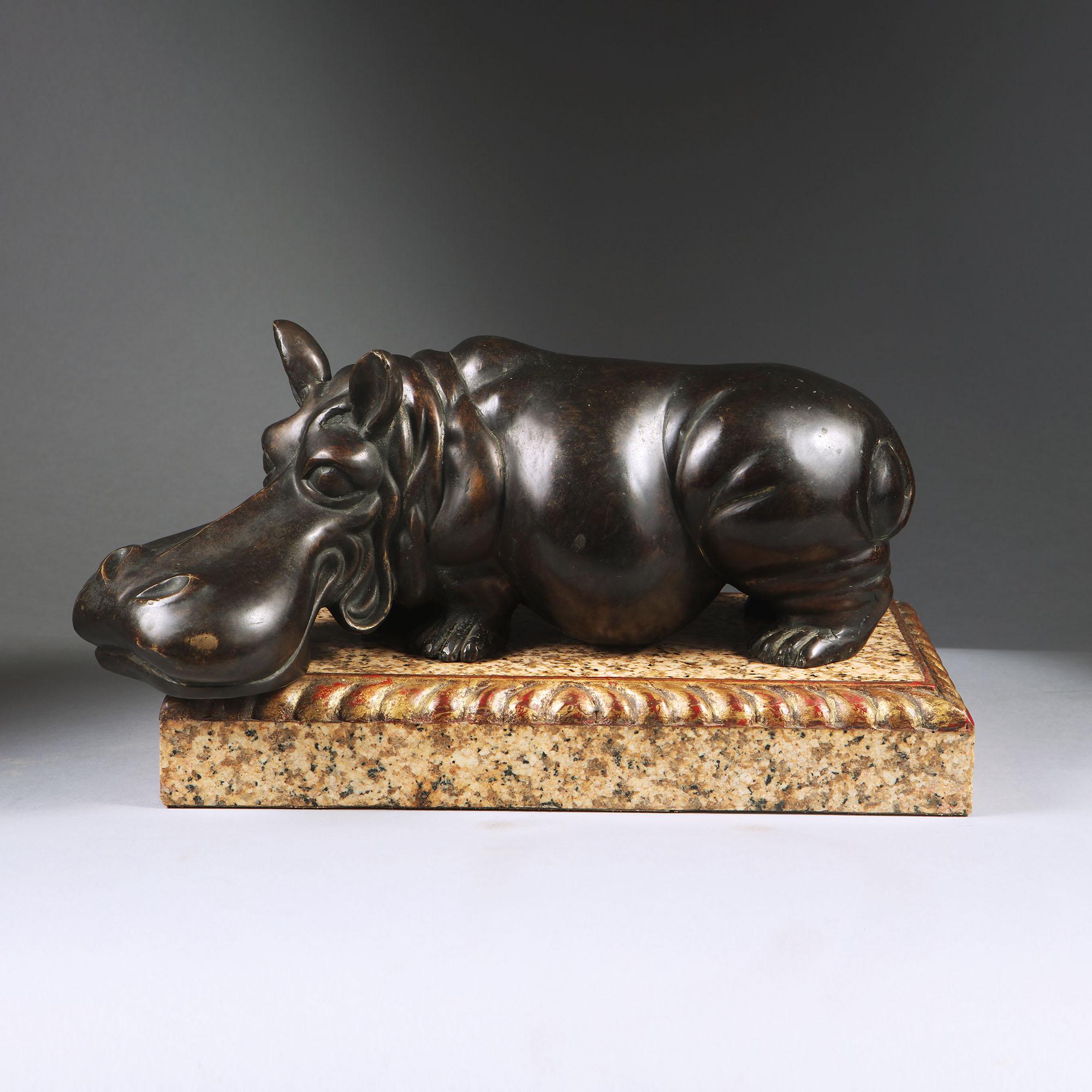 A rather charming, novel mid century bronze hippopotamus on a marble base with gilt border.