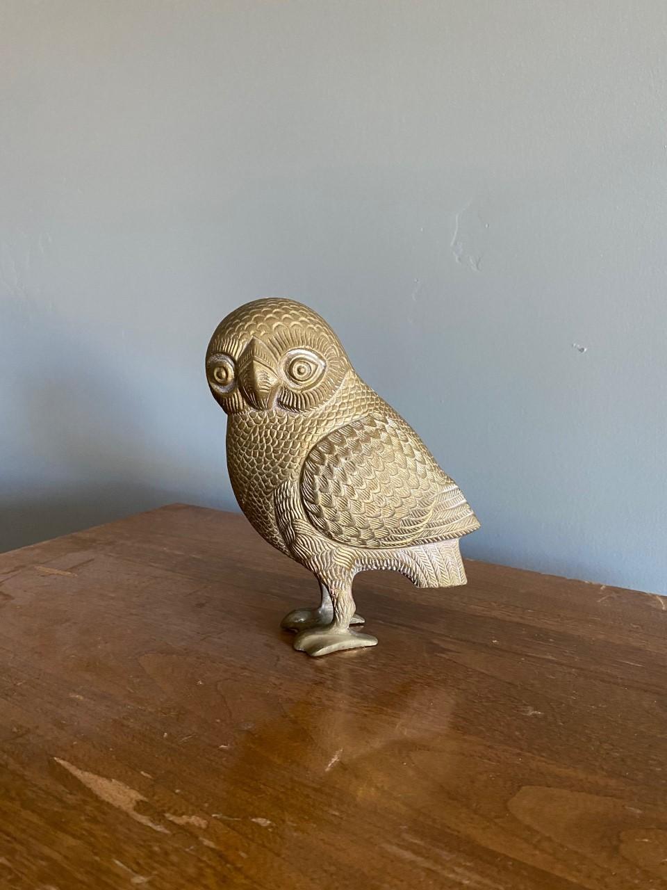 Enigmatic and sublime bronze sculpture of owl of Athena. Traditionally a companion to the goddess of wisdom, the owl representation has been associated with knowledge and wisdom. This mid century representation in bronze of the owl of Athena