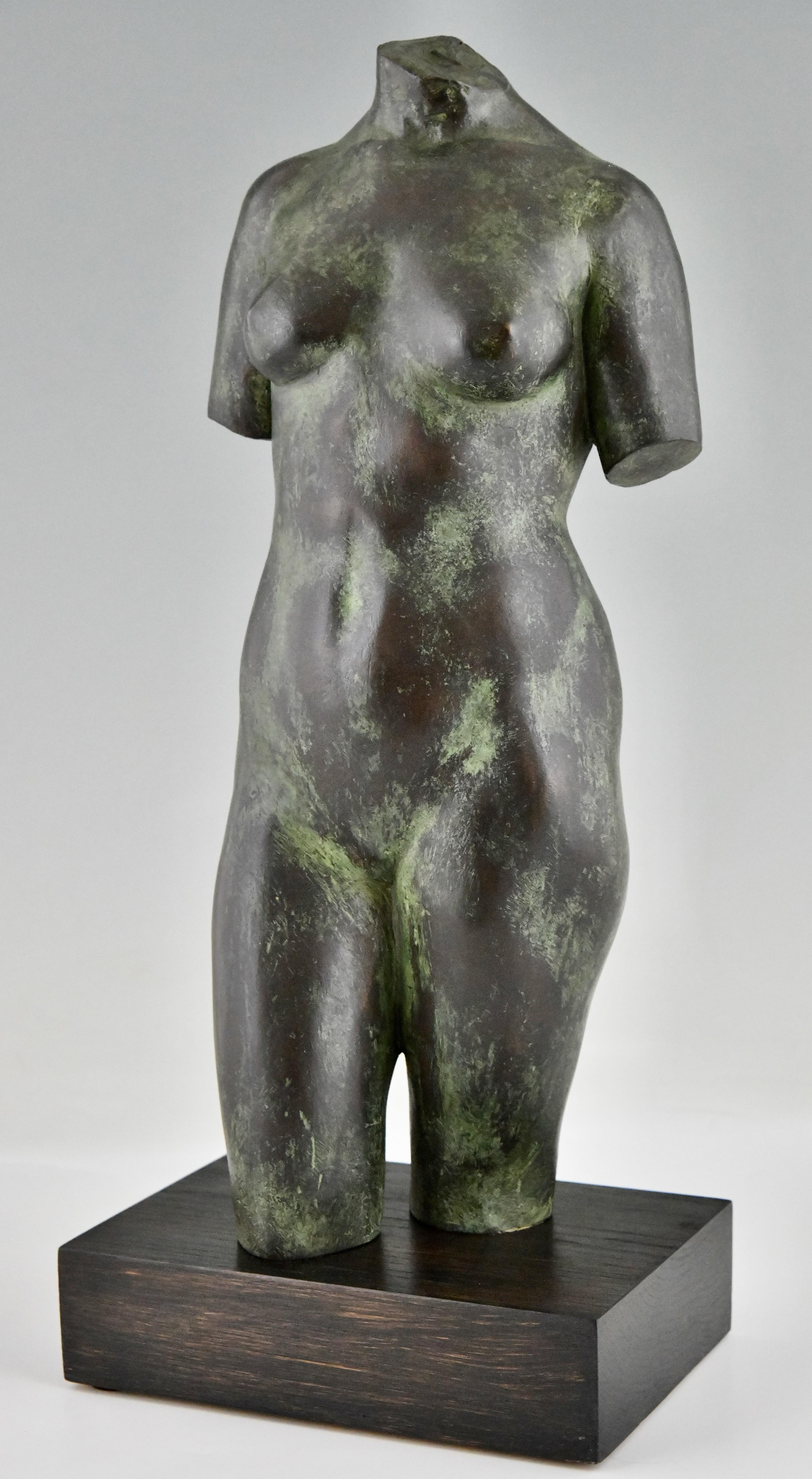 Midcentury bronze sculpture female torso by Fernando Bach Esteve (1929-1992).
Patinated bronze on a wooden base. 
Spain 1970. 
Literature: 
Fernando Bach Esteve i Massaneda, artista i mestre.