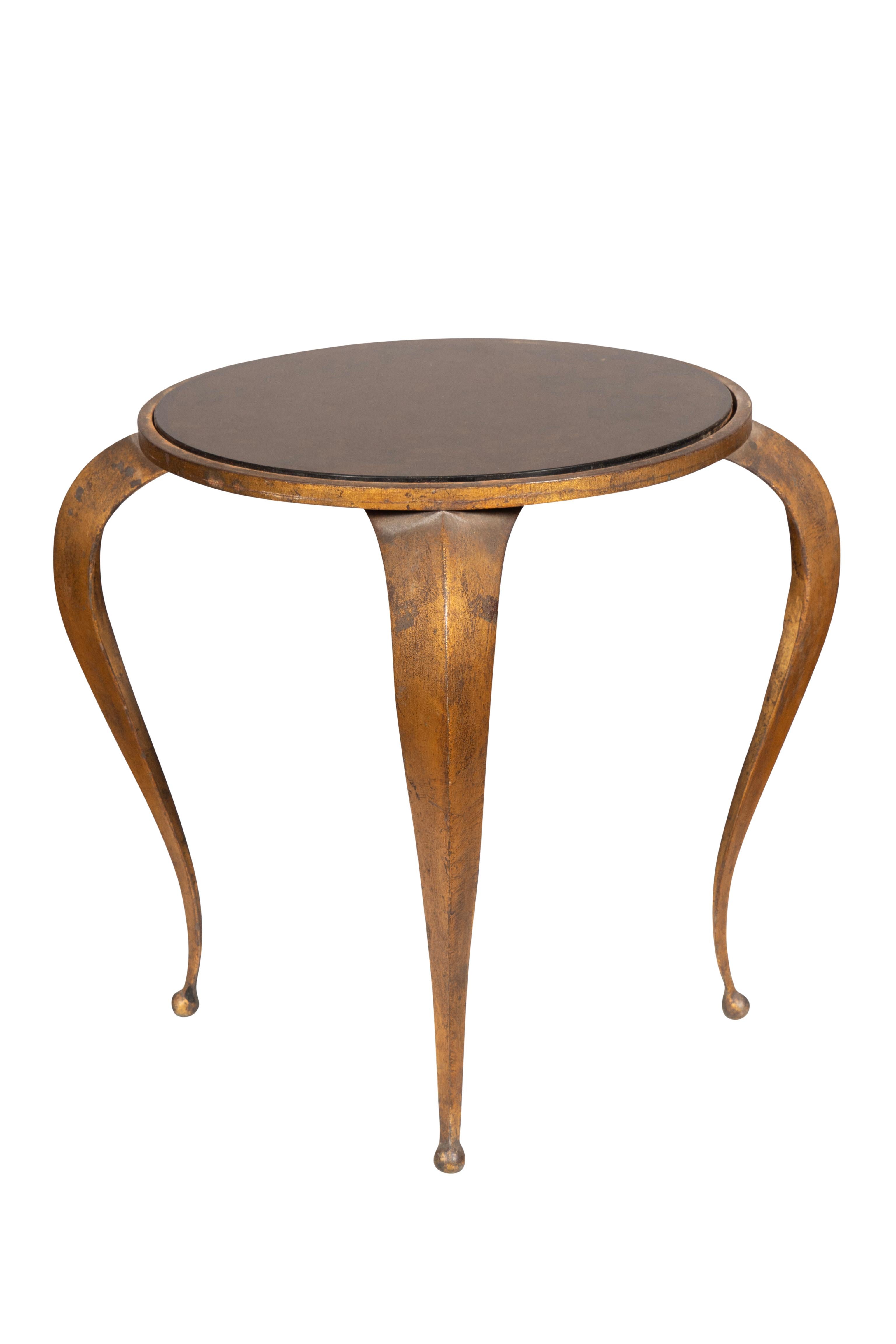 Circular glass top with faux tortoise painted in reverse. Four curved legs with bronze finish.