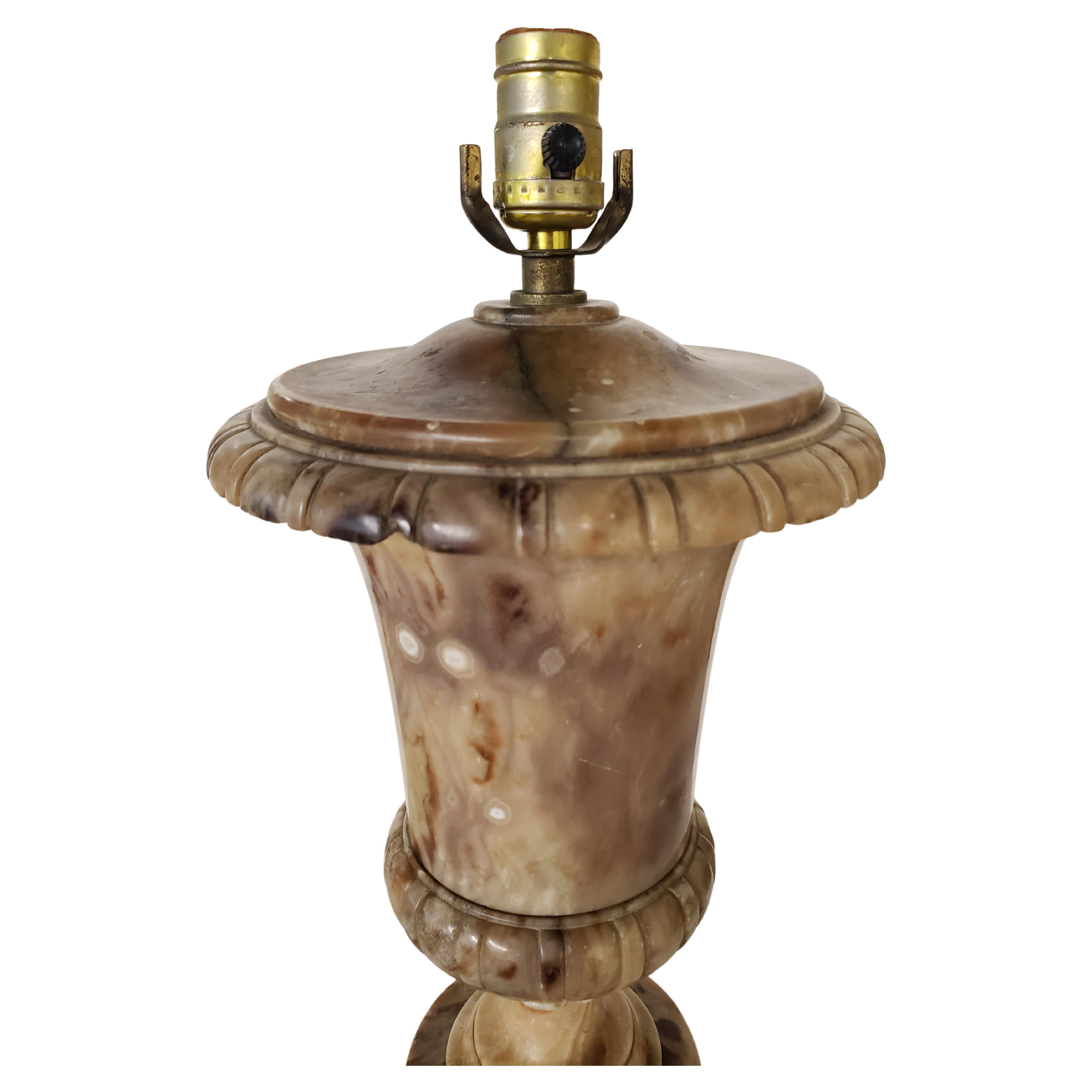 Mid century brown Alabaster Urn table lamp from the 60s. Good vintage condition. Measures 9 inches in diameter and stands 21.5 inches tall to the top of the socket. Lamp is 6 inches in diameter at the base.
