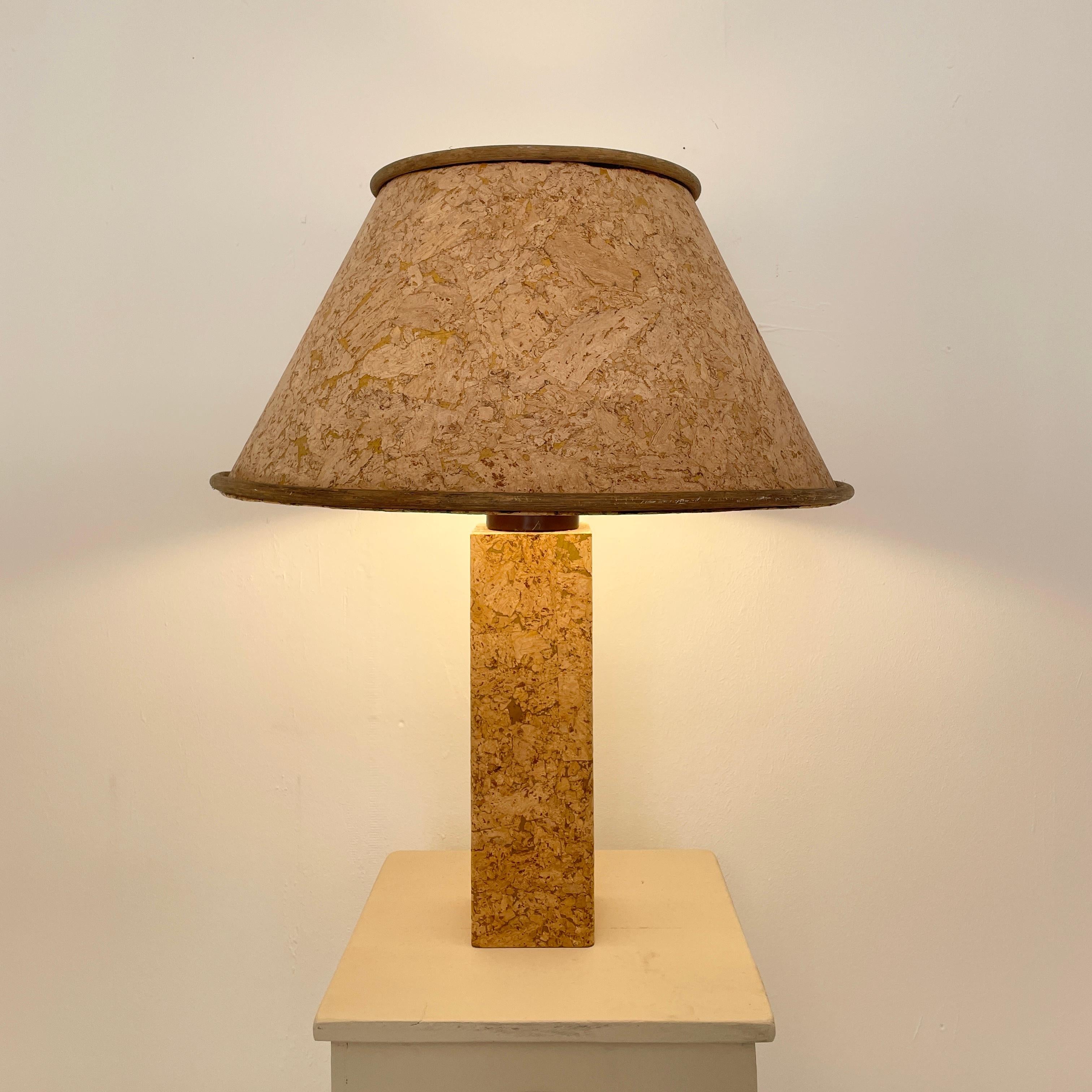 This fantastic Mid Century Brown Cork table lamp in the Style of Ingo Maurer was made in the 1970s.
The base is wood which is veneered in cork and the shade is also in cork which makes a beautiful light.
This piece is in a great original vintage