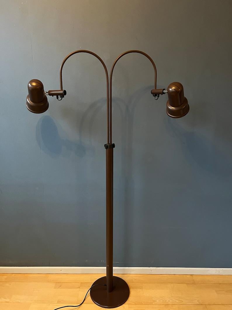 Highly flexible mid century GEPO space age floor lamp with two arms and adjustable shades. The two cones can be turned in any possible direction and can be repositioned along the arc. The arcs can be aligned or placed in opposite direction. The arcs