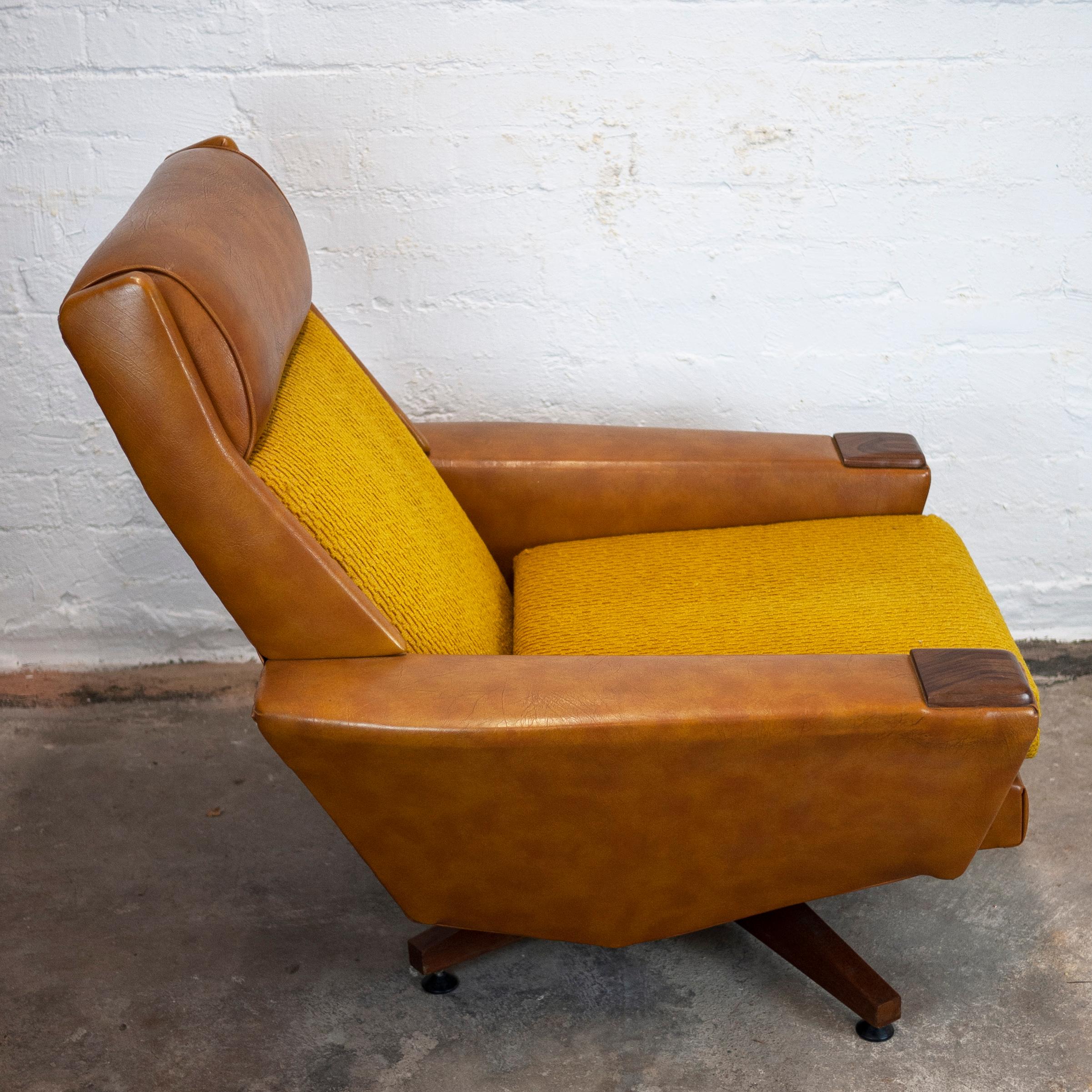 A brown leather and textured mustard fabric 1970s armchair with springs.

Manufacturer - Unknown

Design Period - 1970 to 1979

Style - Vintage, Mid-Century

Detailed Condition - Good

Restoration and Damage Details - Fabric is original so