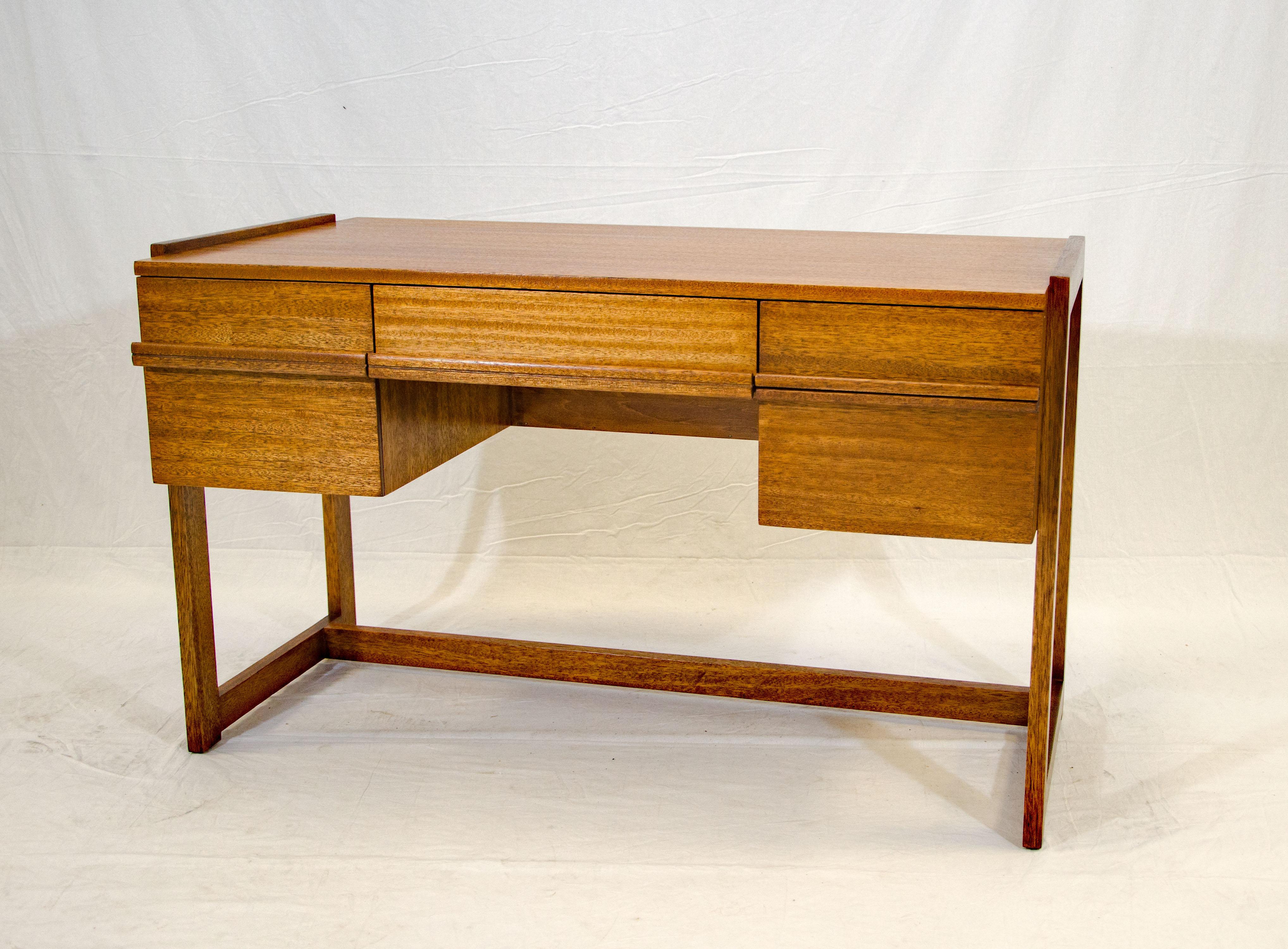 Unusual midcentury desk designed by Paul Laszlo for Brown Saltman. It is finished on all sides so a great piece for placement away from a wall. The seating side has one deep drawer with an interior measurement of 10 3/4