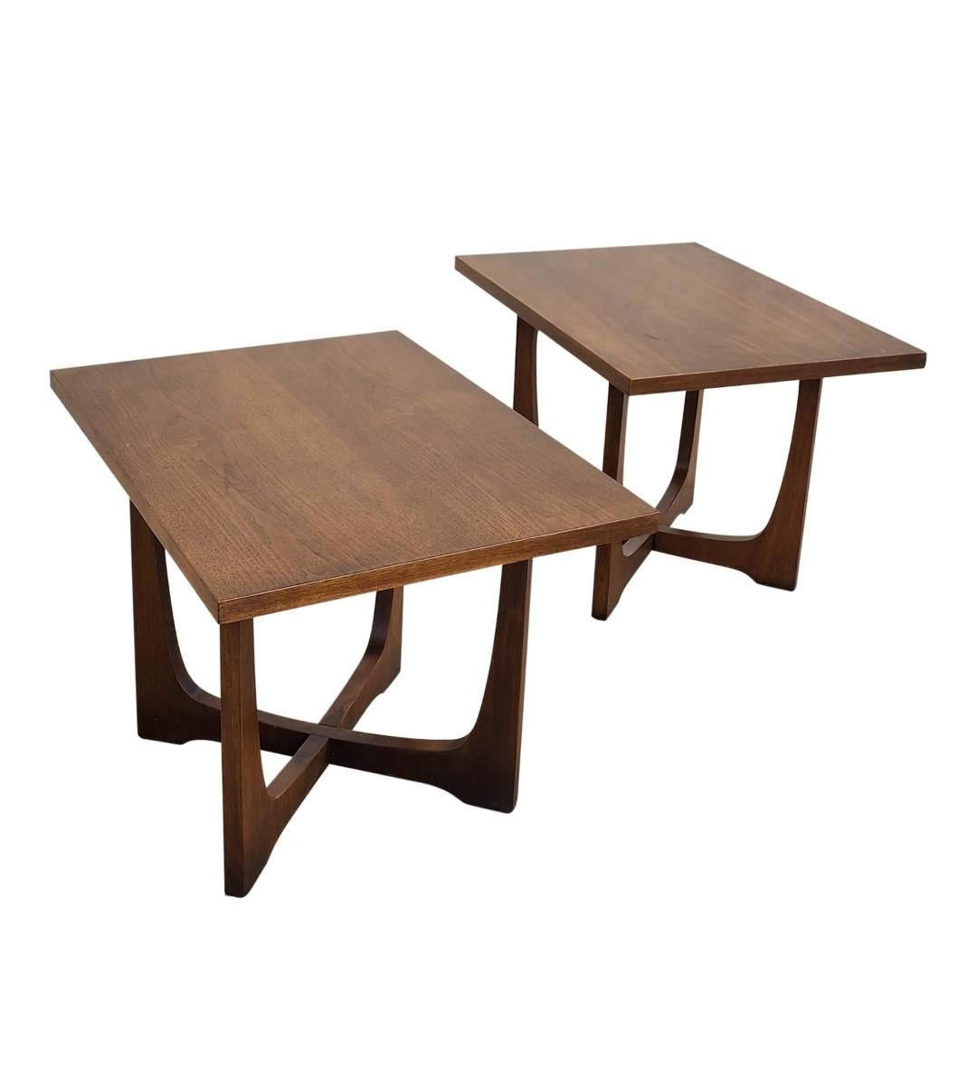 These Broyhill Emphasis walnut end tables are a classic example of mid-century modern. They feature the iconic sculpted base. These pieces would look fantastic in any living or entertainment room!