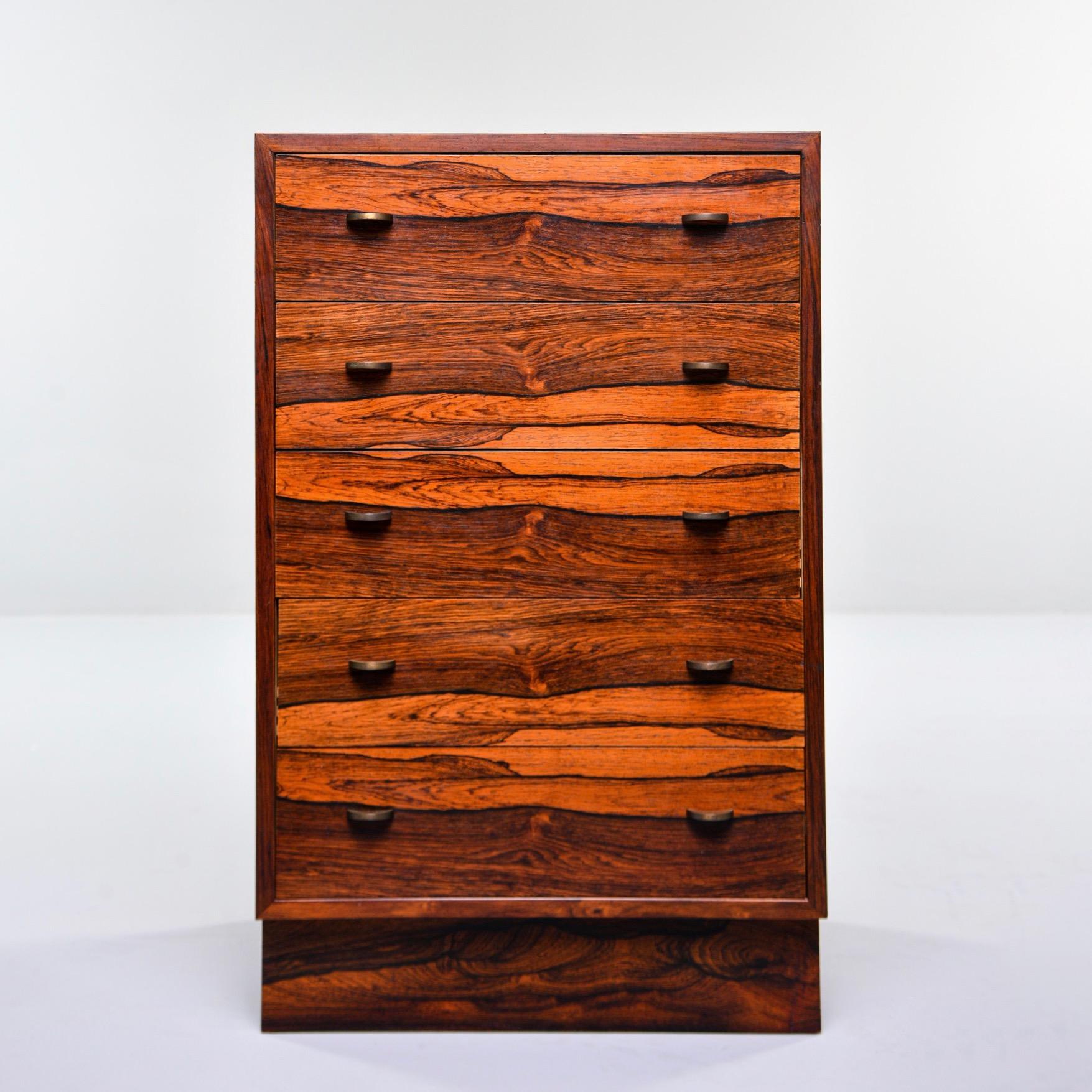 Small chest of five drawers in rosewood by Norwegian maker Bruksbo for Mellemstrands, circa 1970s. Streamlined design and versatile size make this a cabinet that can be placed next to a sofa or bed. Original drawer pulls, dovetail construction,