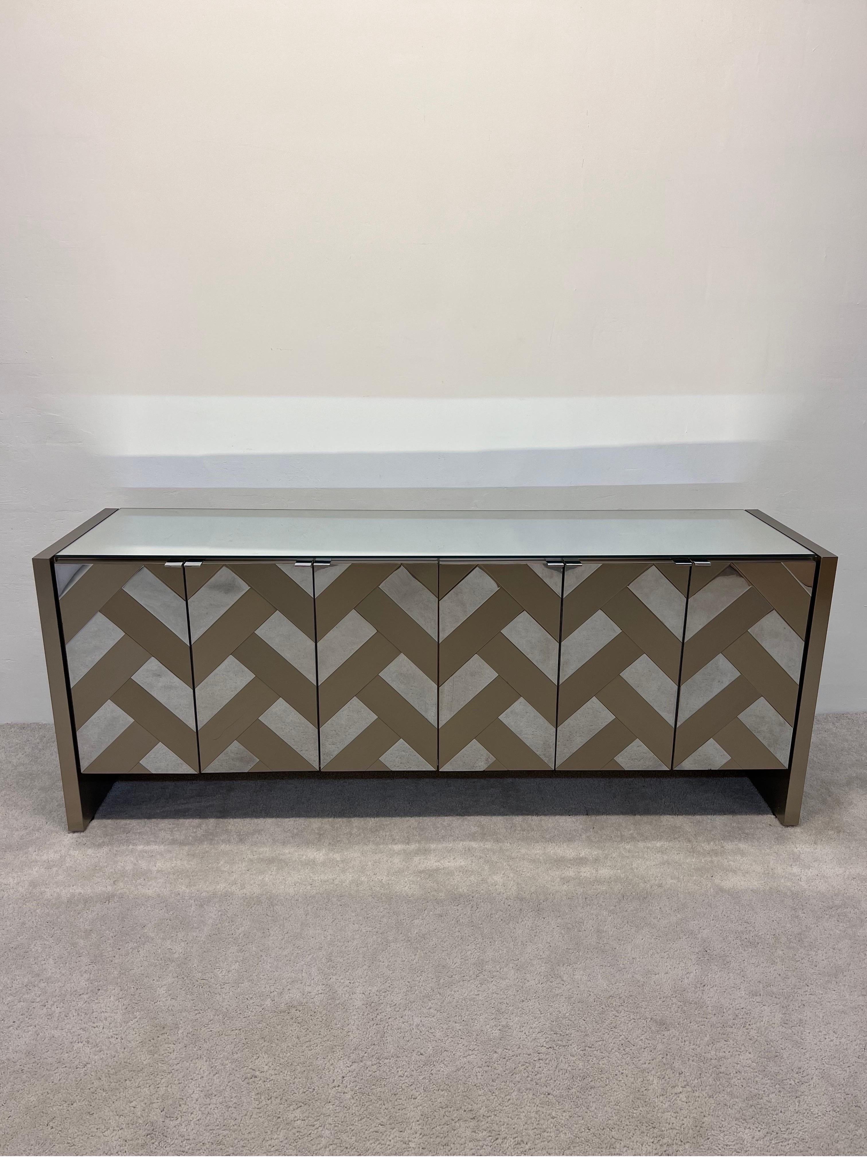 Herringbone patterned chrome and bronze finish credenza or sideboard with mirror top buy Ello Furniture, 1970s.