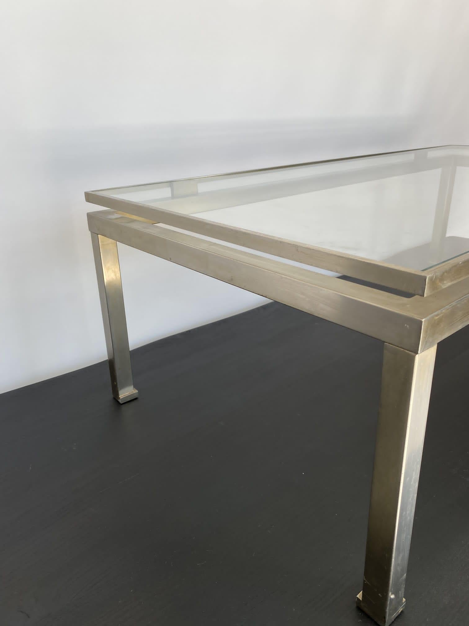 Mid-Century Brushed steel brass coffee table by Guy Lefevre for Maison Jansen 70
Good condition
Dimensions
H 37 cm 
D 112 cm 
W 57 cm.