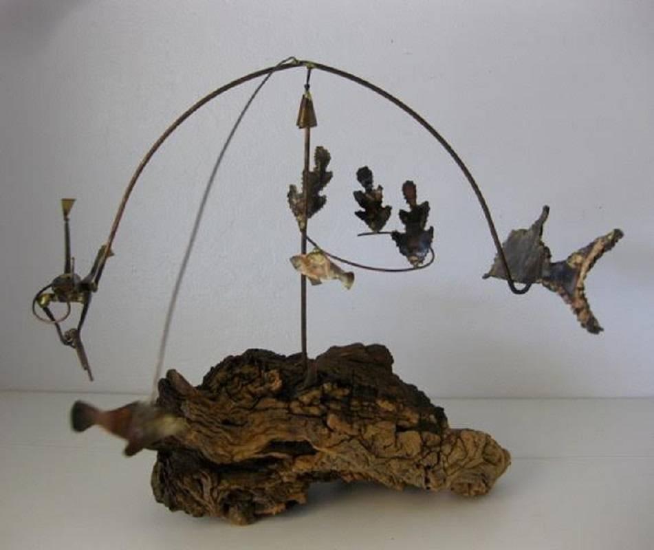 Mid-Century Modern Brutalist rotating Kinetic sculpture. The sculpture is made of welded and cut brass welded to heavy gauge brass wire, mounted on a driftwood base. The driftwood base has a brass heavy gauge wire with a stationary corkscrew band of