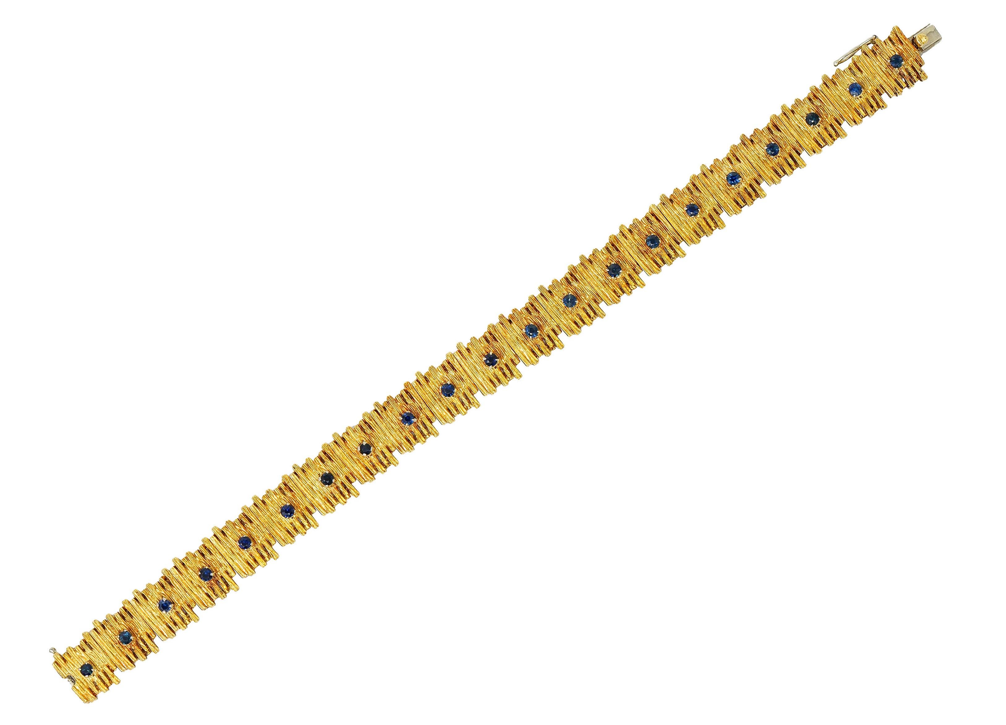 Comprised of textured 18 karat gold links with claw set sapphire cabochon

Dimensional links of uneven striated edges in a Brutalist fashion

Each with a claw set round sapphire cabochon

Well matched and a deep saturated blue

Completed with a
