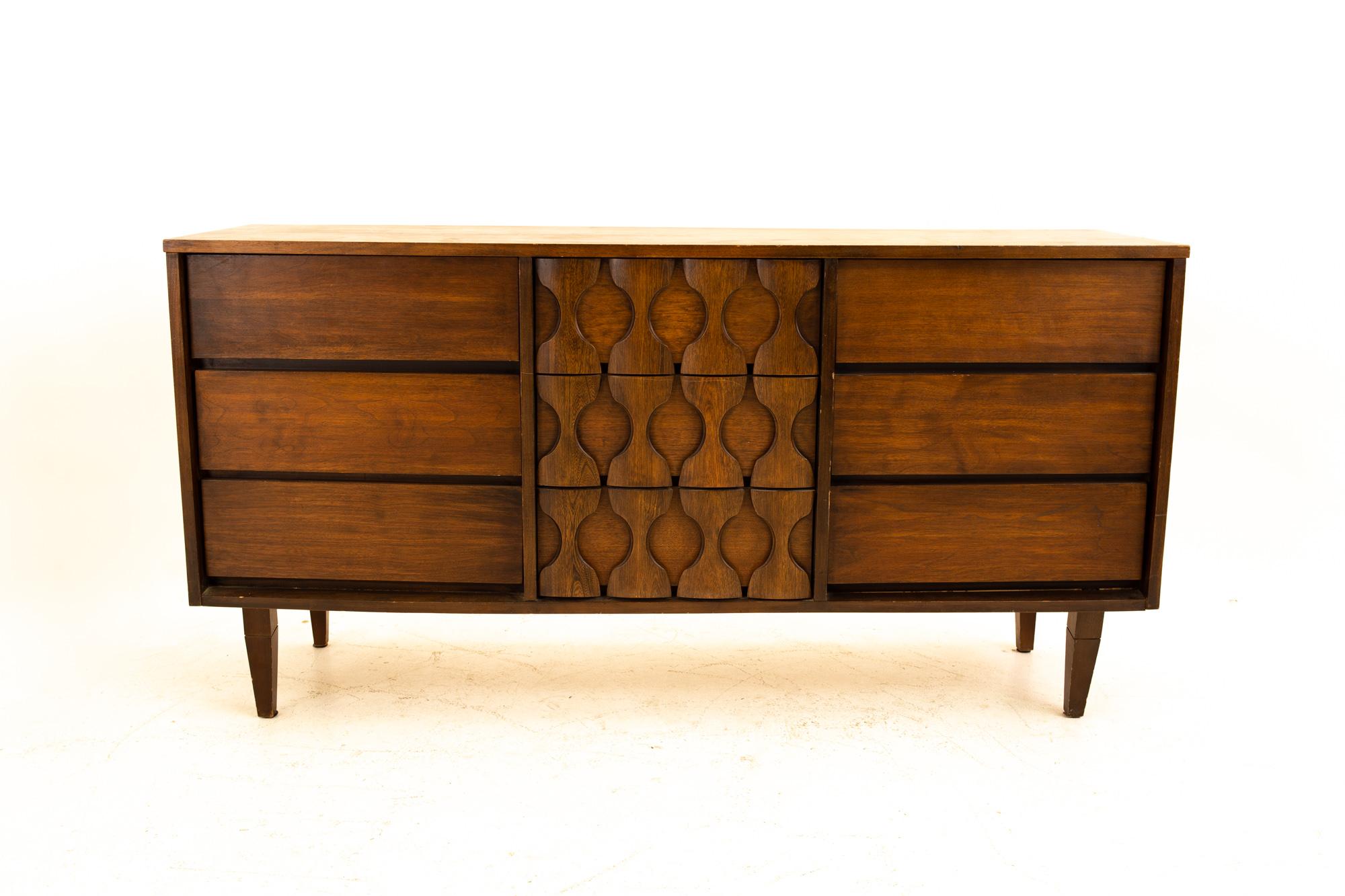 Midcentury Brutalist 9-drawer lowboy dresser
Dresser measures: 60 wide x 17.75 deep x 31 high

All pieces of furniture can be had in what we call restored vintage condition. That means the piece is restored upon purchase so it’s free of