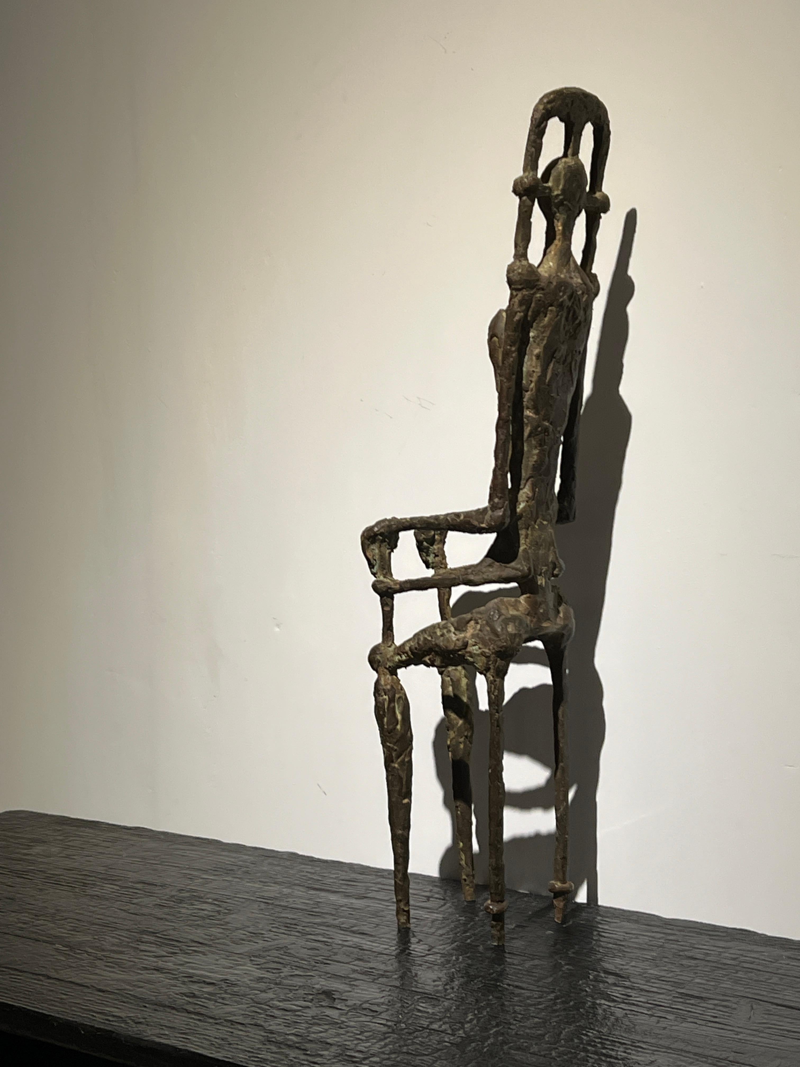 Large bronze sculpture of a sitting figure in expressionist / cubist style,

This sculpture with its greenish patina and rough textures emphasizes the strong abstract shapes of human figure and chair/thrown. The sculpture dates from the post war