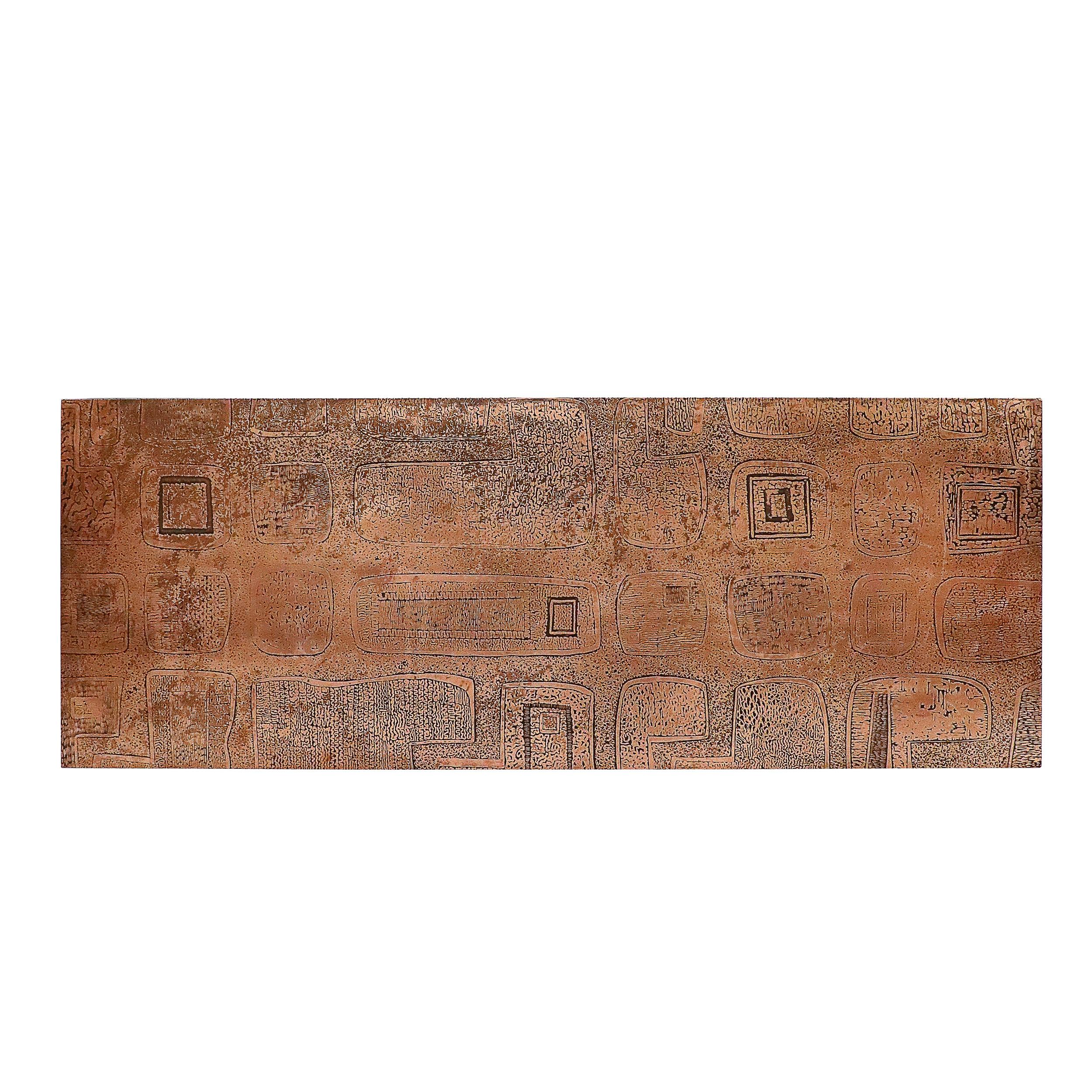 This striking Mid-Century Brutalist cocktail table is a masterful blend of art and functional design, showcasing bold textural contrasts and abstract expression. The table’s top features an eye-catching copper surface, intricately worked with