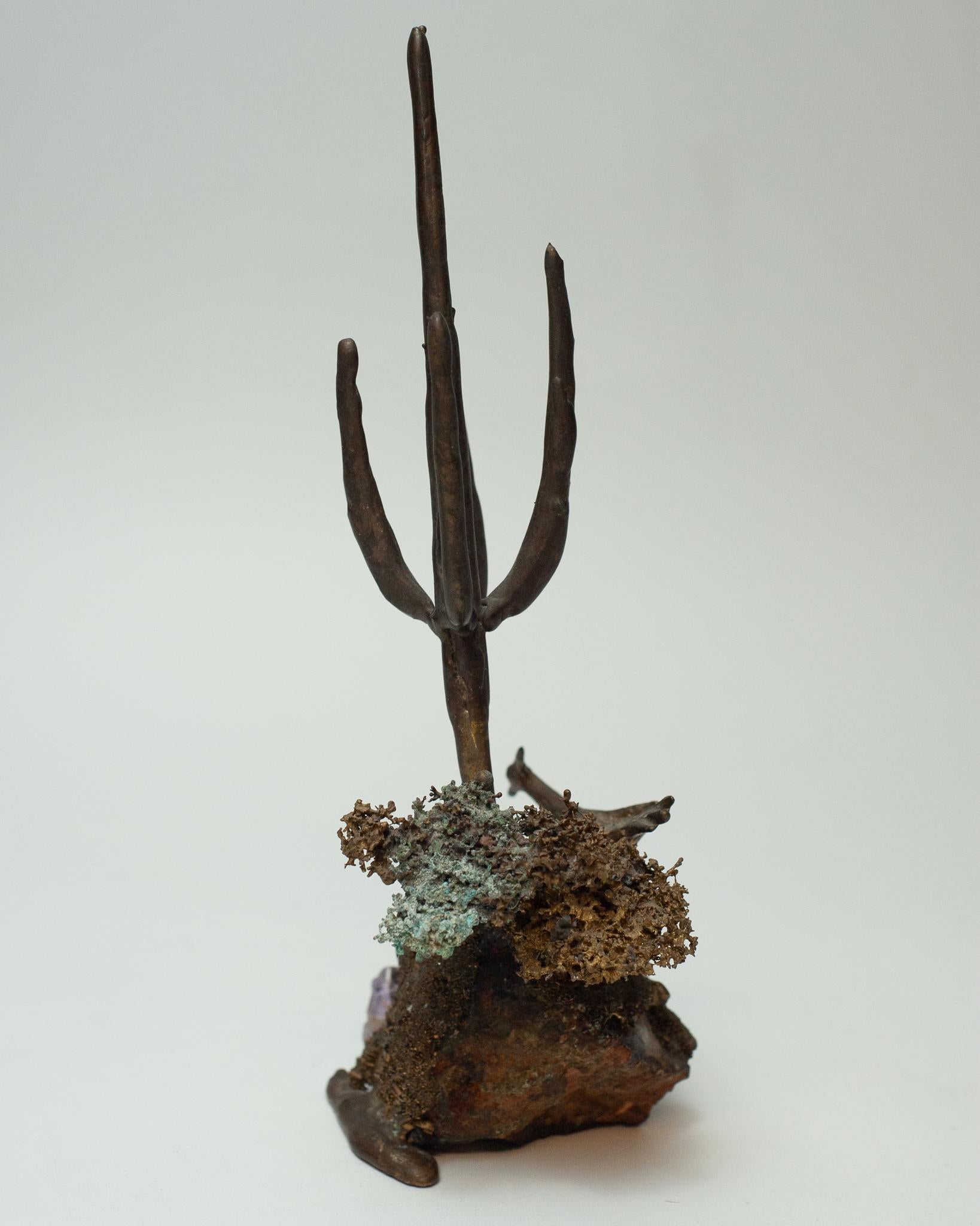A unique bronze and amethyst sculpture in a truly Brutalist / organic style treatment with a fine, raw surface patina. Bird, textured brush and cactus motifs are abstracted in cast bronze on a center support of natural amethyst. This sculpture is